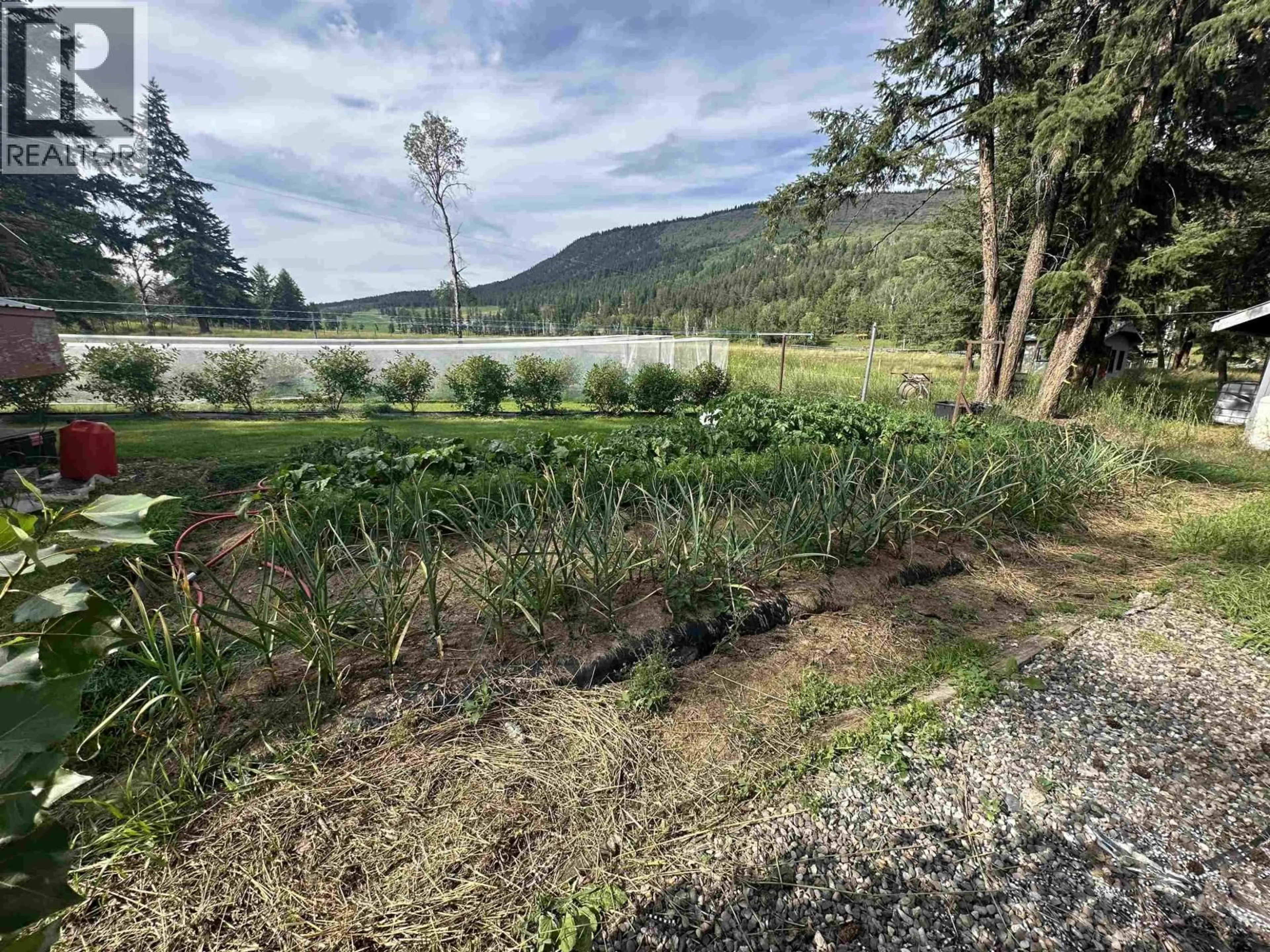 A pic from outside/outdoor area/front of a property/back of a property/a pic from drone, water/lake/river/ocean view for 8376 SPUR ROAD, McLeese Lake British Columbia V0L1P0
