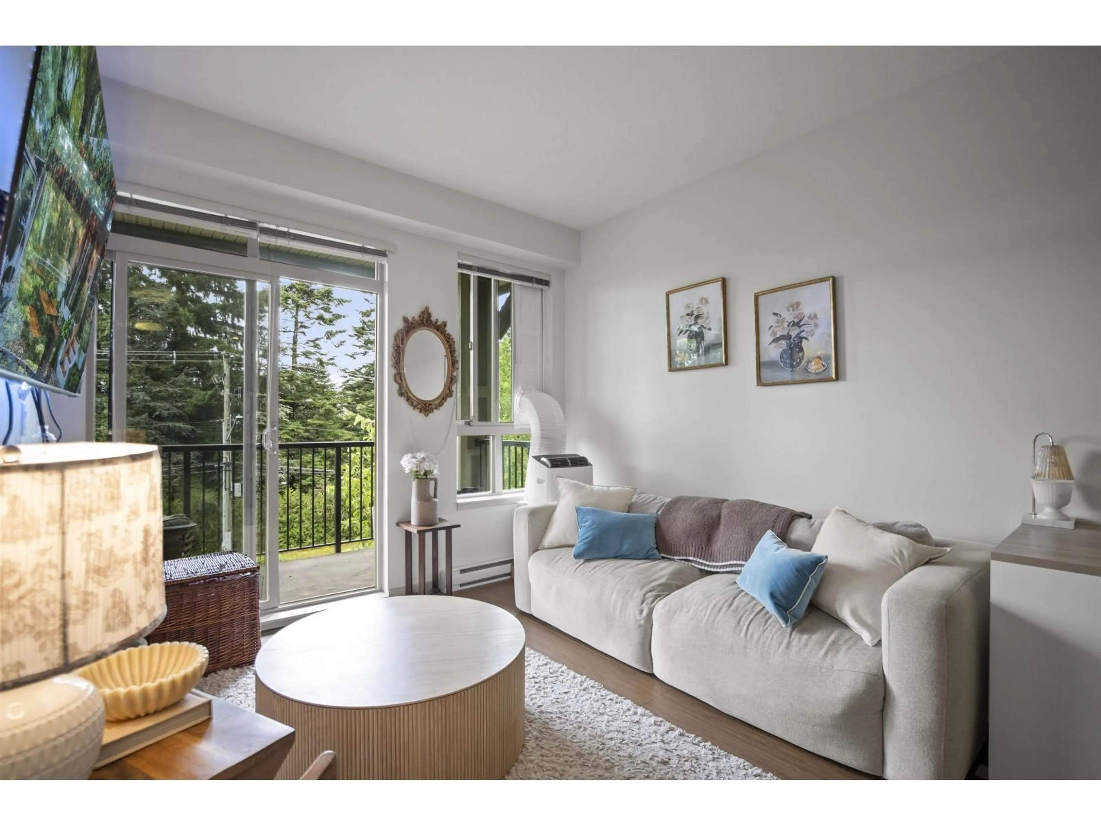 Living room with furniture, wood/laminate floor for 316 - 8695 160, Surrey British Columbia V4N6L6