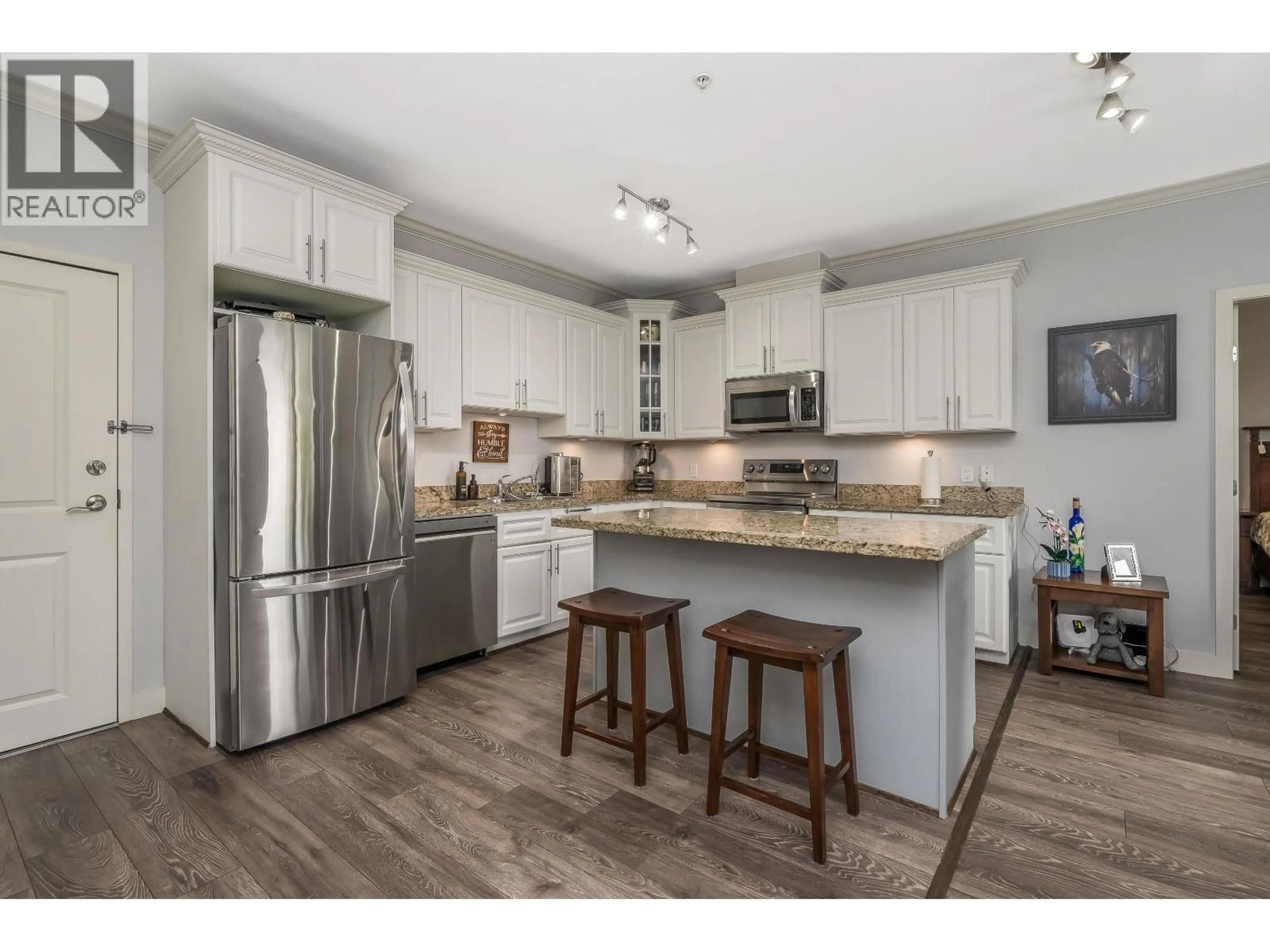 Open concept kitchen, wood/laminate floor for 207 - 22363 SELKIRK AVENUE, Maple Ridge British Columbia V2X2X6