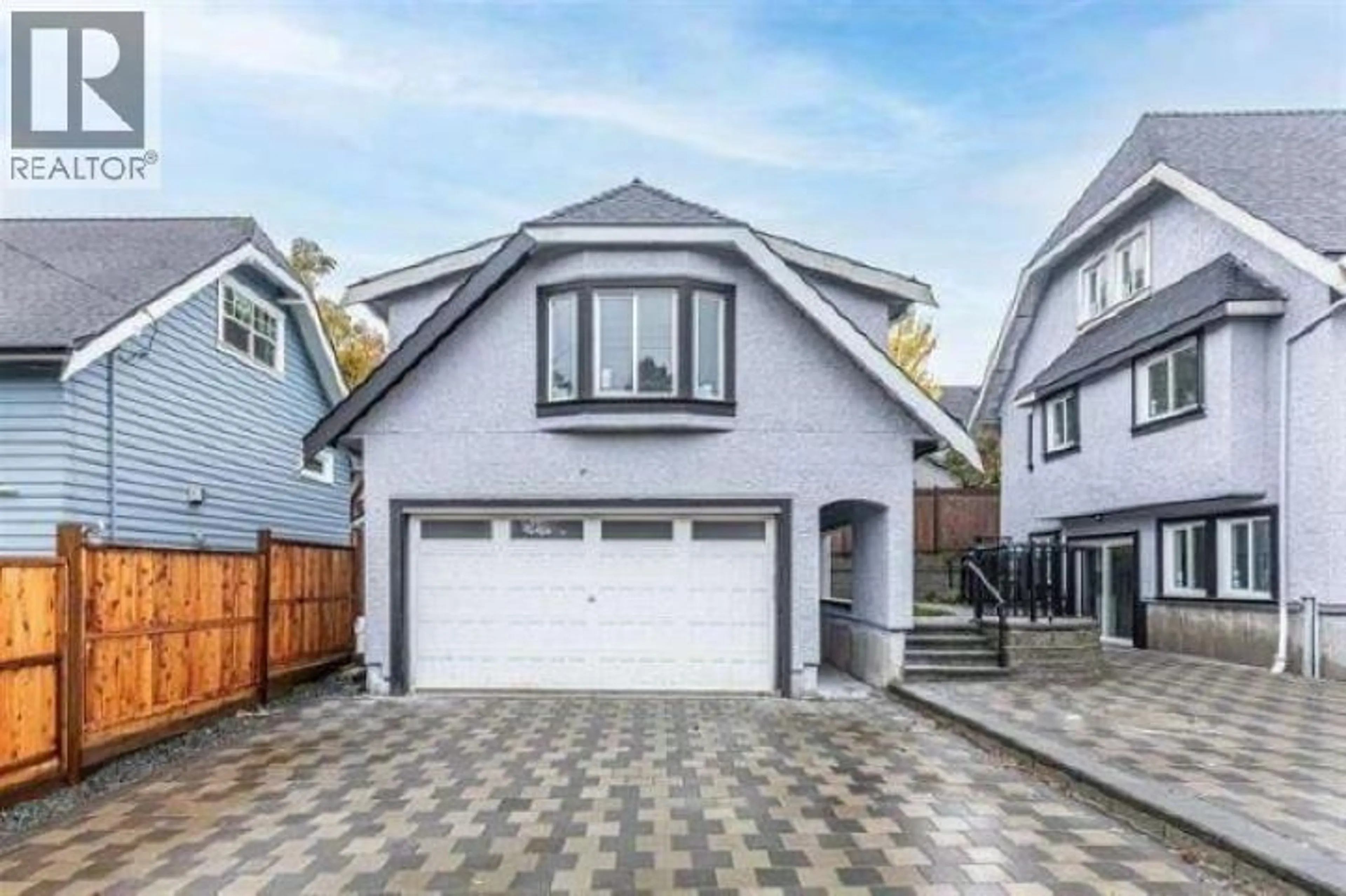 Home with vinyl exterior material, street for 1008 - 1018 24TH AVENUE, Vancouver British Columbia V5V2B1