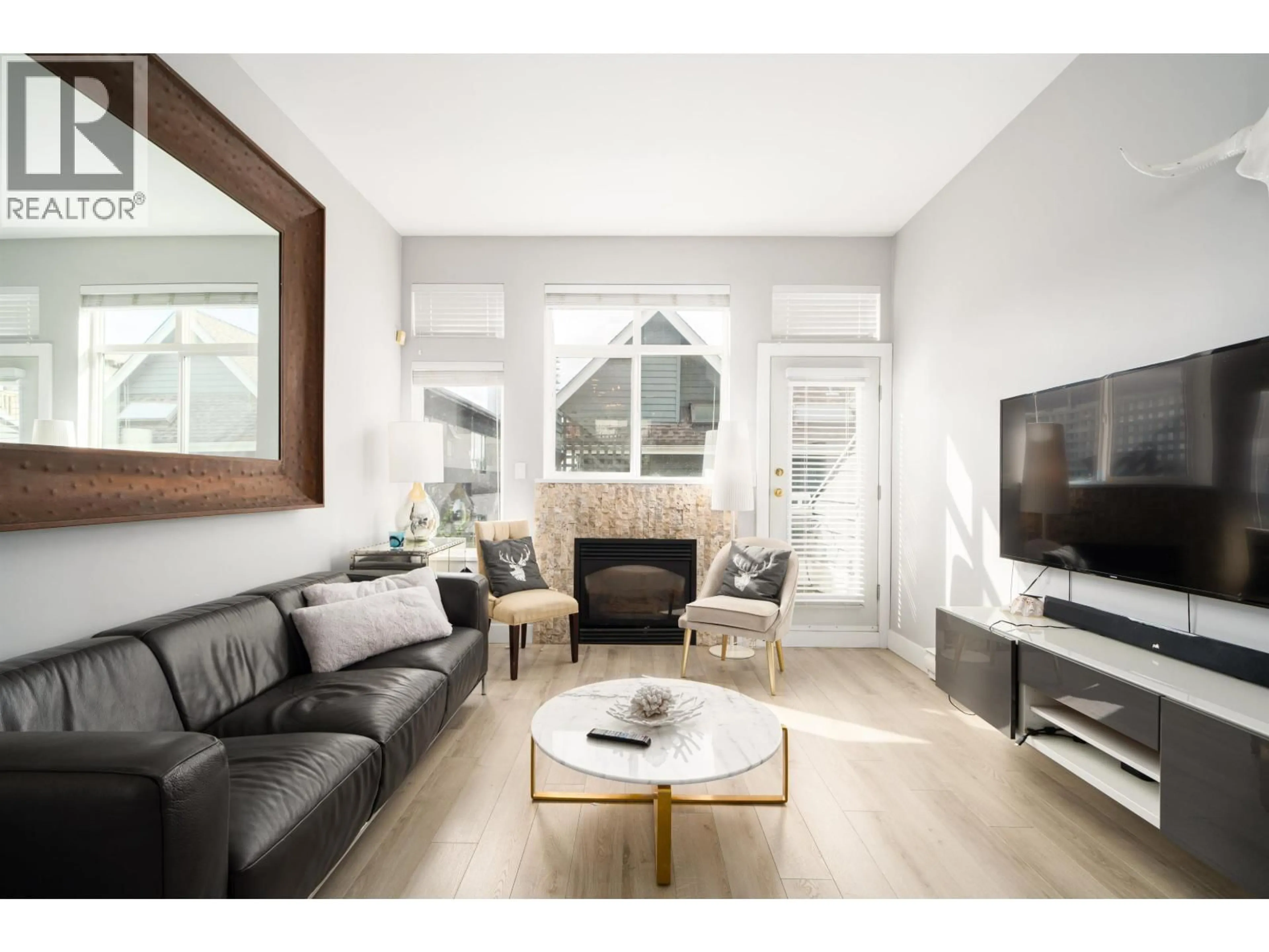 Living room with furniture, wood/laminate floor for D - 136 4TH STREET, North Vancouver British Columbia V7M1H5