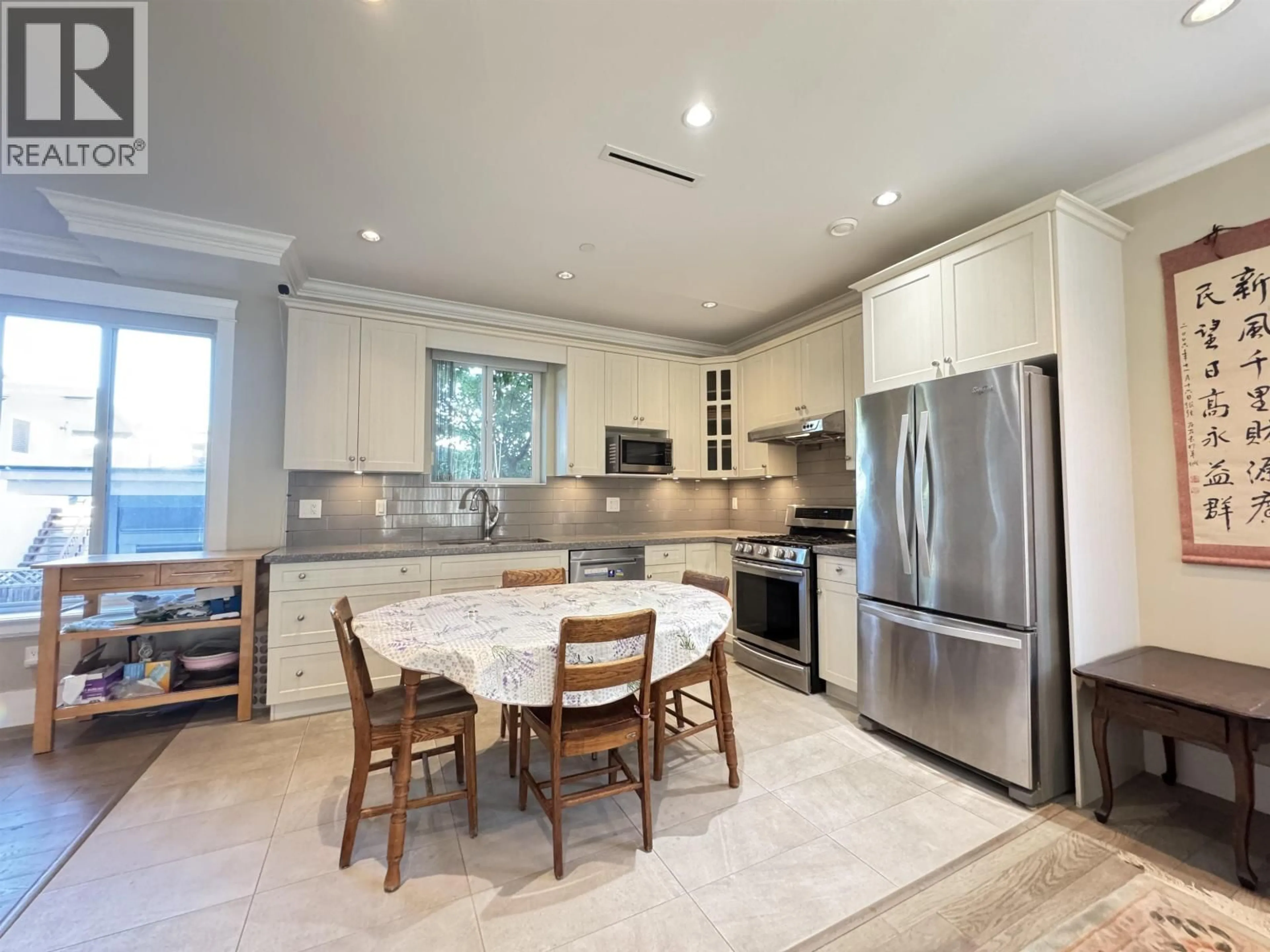 Open concept kitchen, ceramic/tile floor for 5828 QUEBEC STREET, Vancouver British Columbia V5W2N9