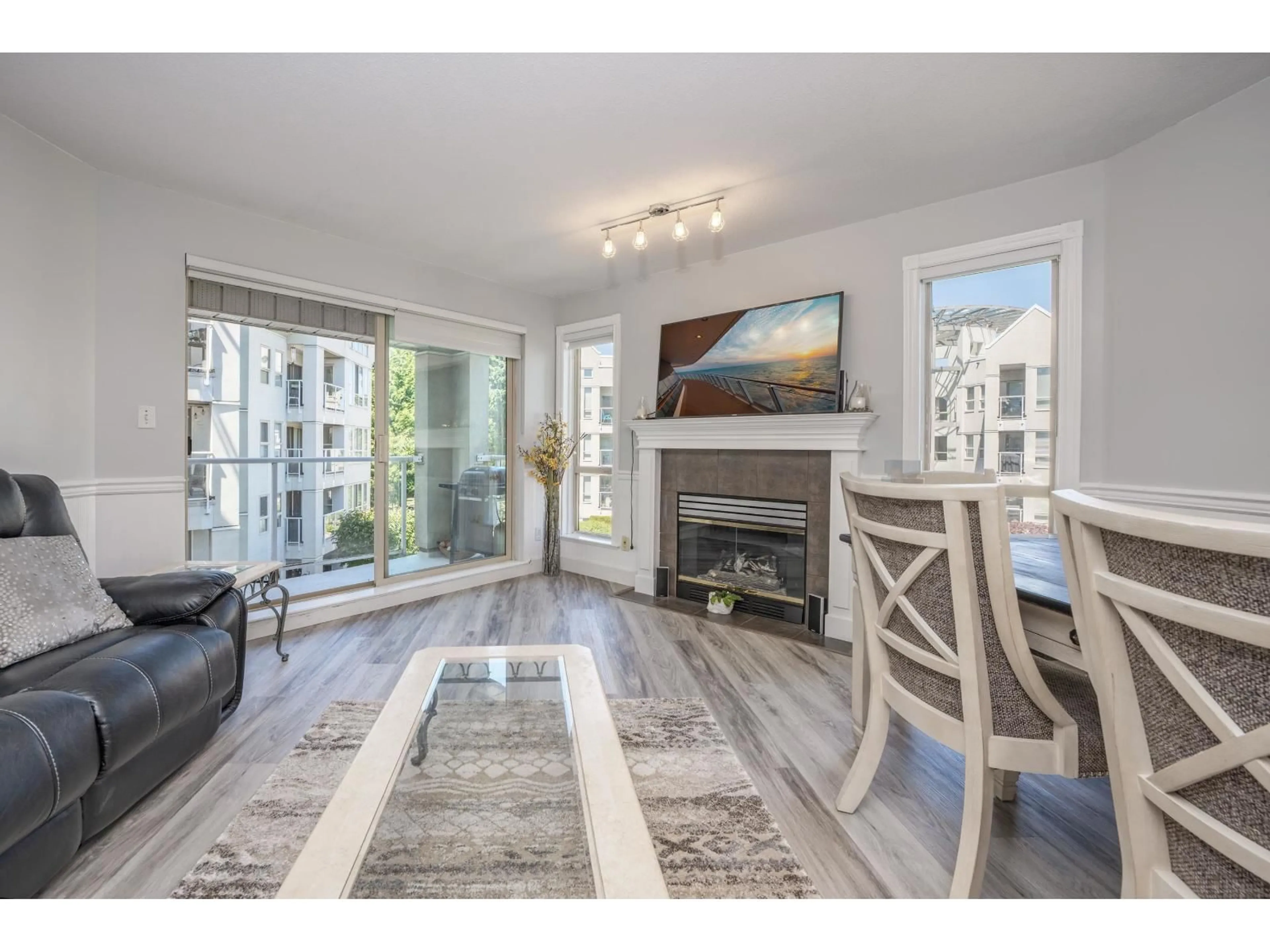 Living room with furniture, wood/laminate floor for 303 - 2575 WARE, Abbotsford British Columbia V2S3E2