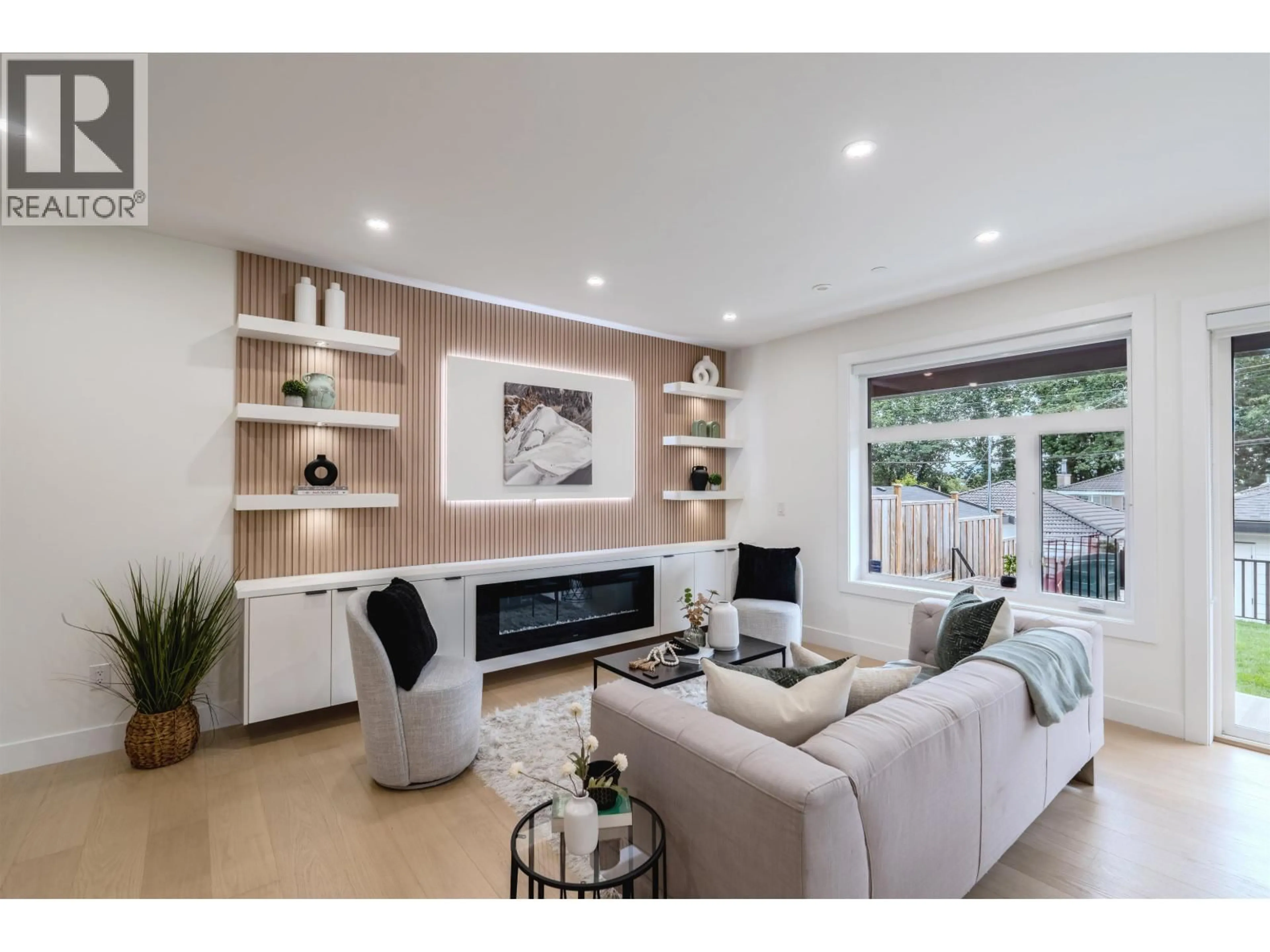 Living room with furniture, wood/laminate floor for 2 - 3576 PENDER STREET, Vancouver British Columbia V5K2E3