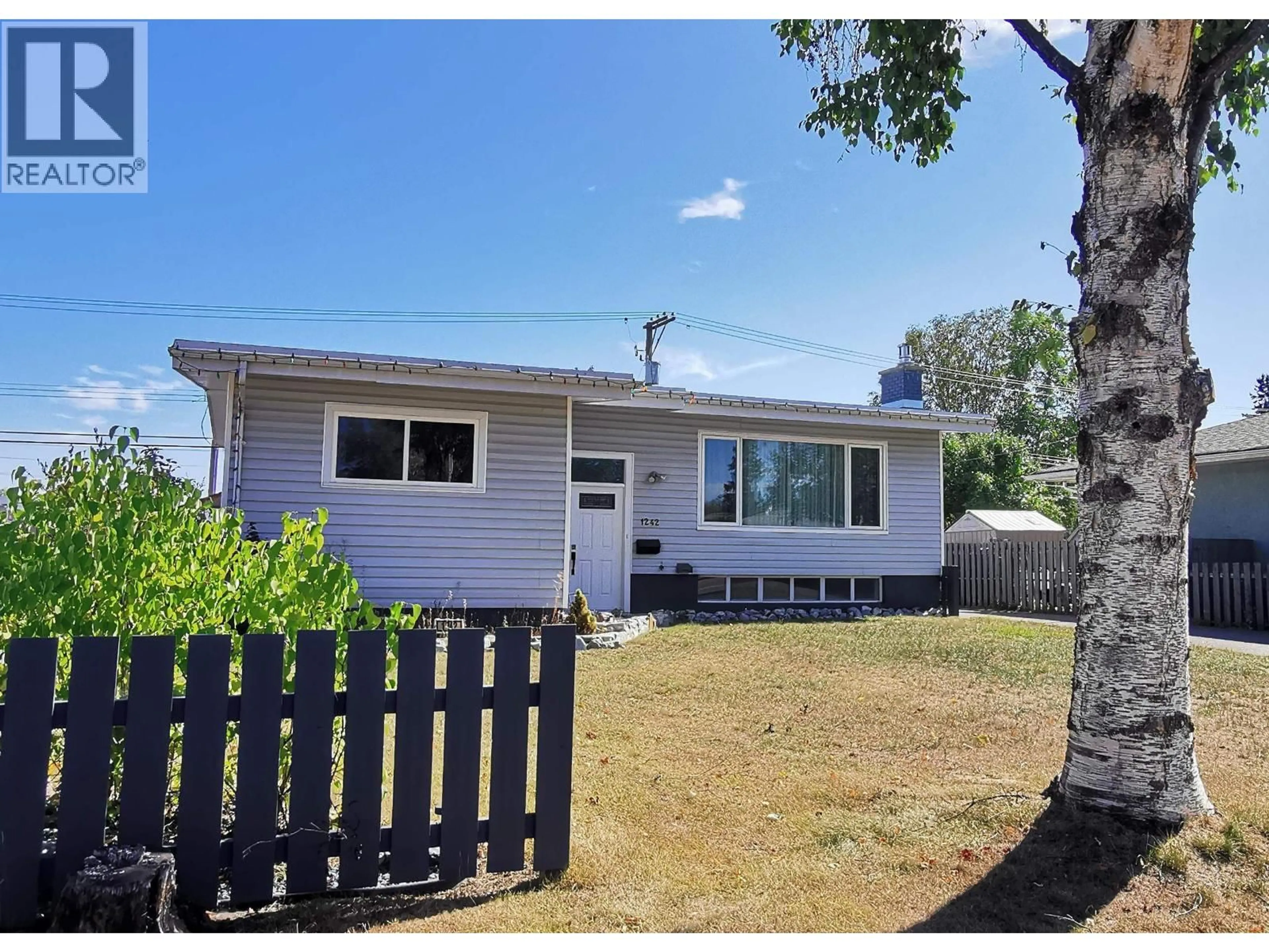 Home with vinyl exterior material, street for 1242 CARNEY STREET, Prince George British Columbia V2M2L2