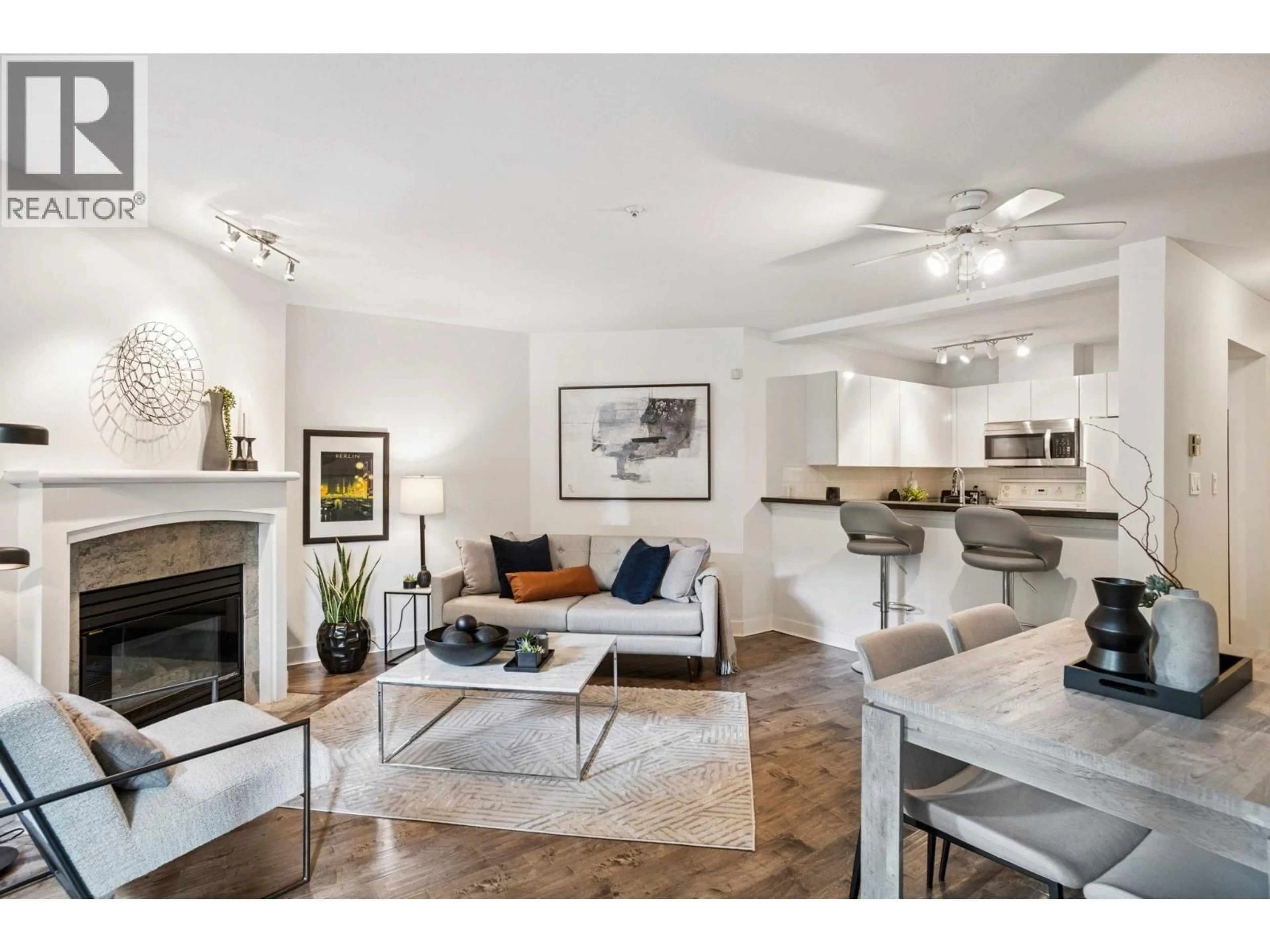 Living room with furniture, unknown for 101 - 8460 JELLICOE STREET, Vancouver British Columbia V5S4S8