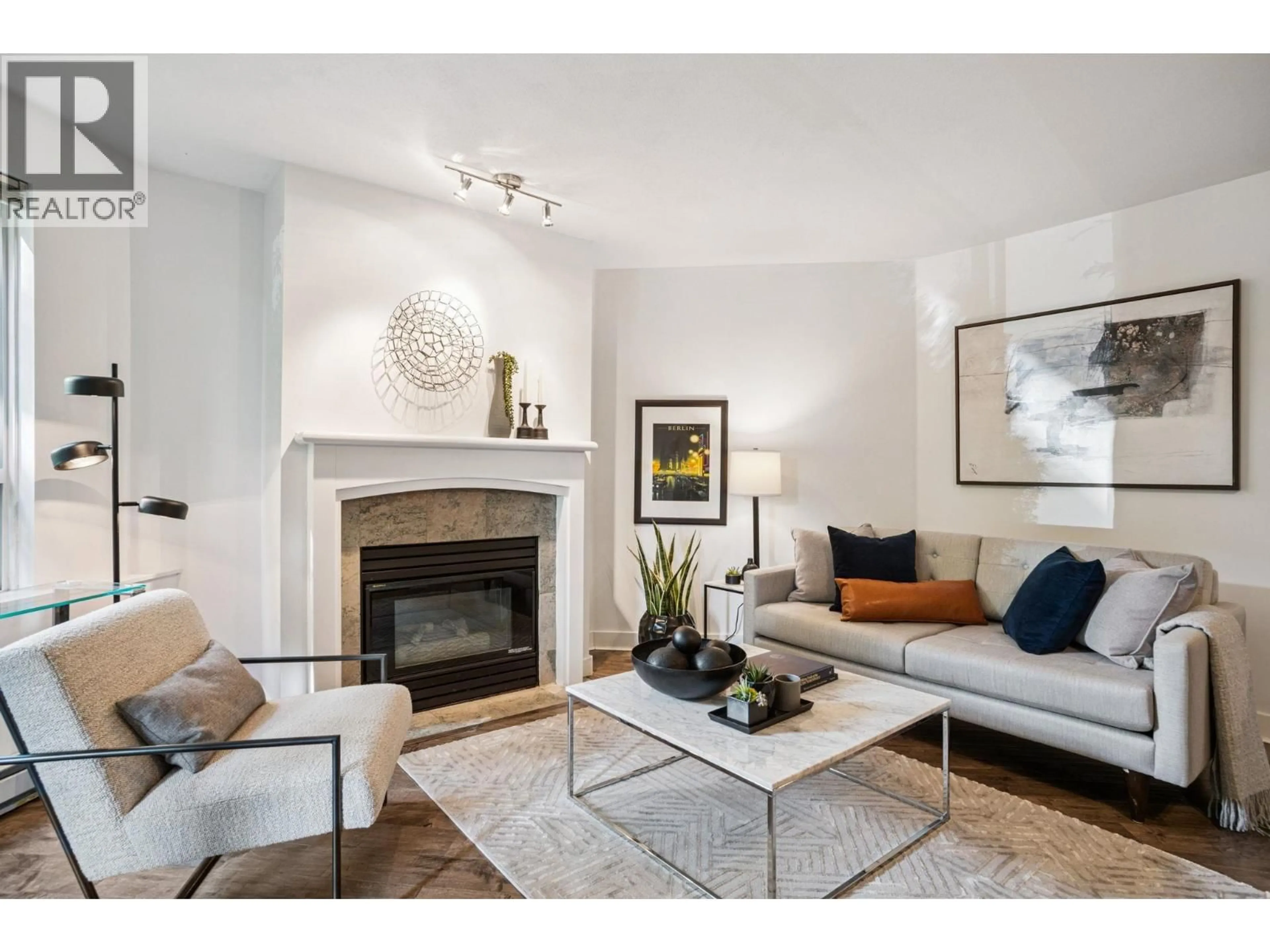 Living room with furniture, unknown for 101 - 8460 JELLICOE STREET, Vancouver British Columbia V5S4S8