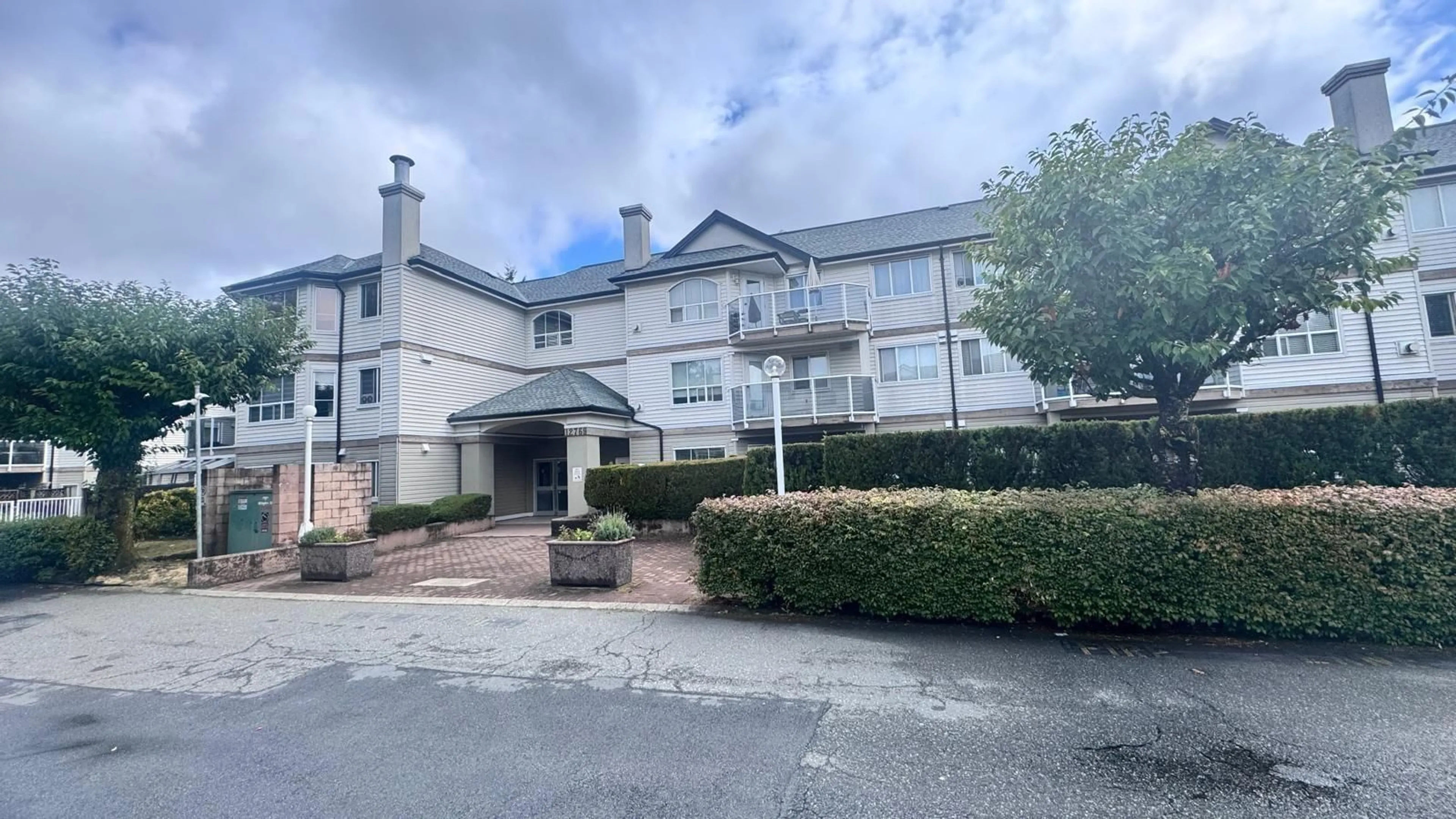 A pic from outside/outdoor area/front of a property/back of a property/a pic from drone, unknown for 303 - 12769 72, Surrey British Columbia V3W2M7