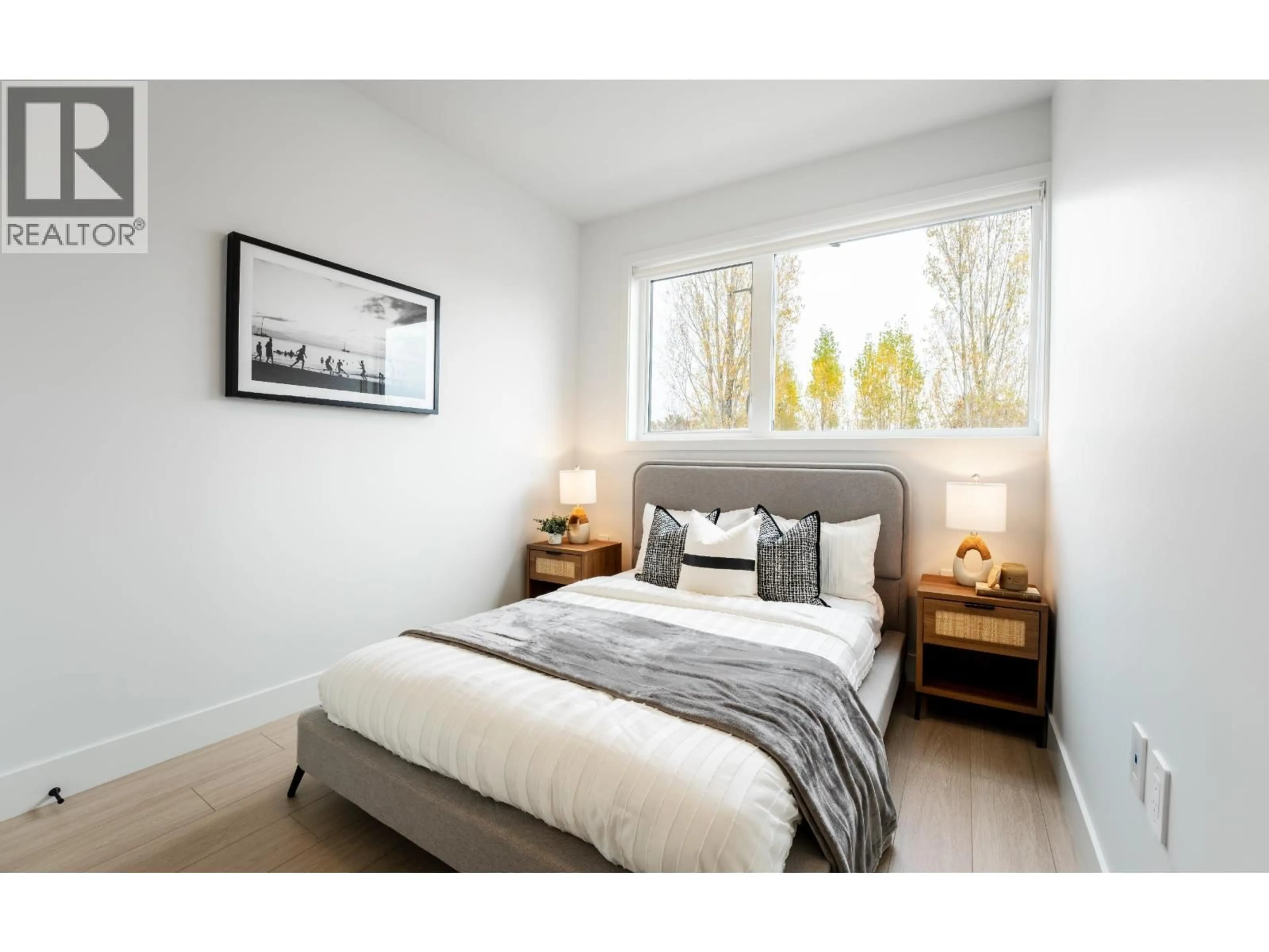Bedroom with bed, wood/laminate floor for 10 - 8300 NO. 3 ROAD, Richmond British Columbia V6Y2E3