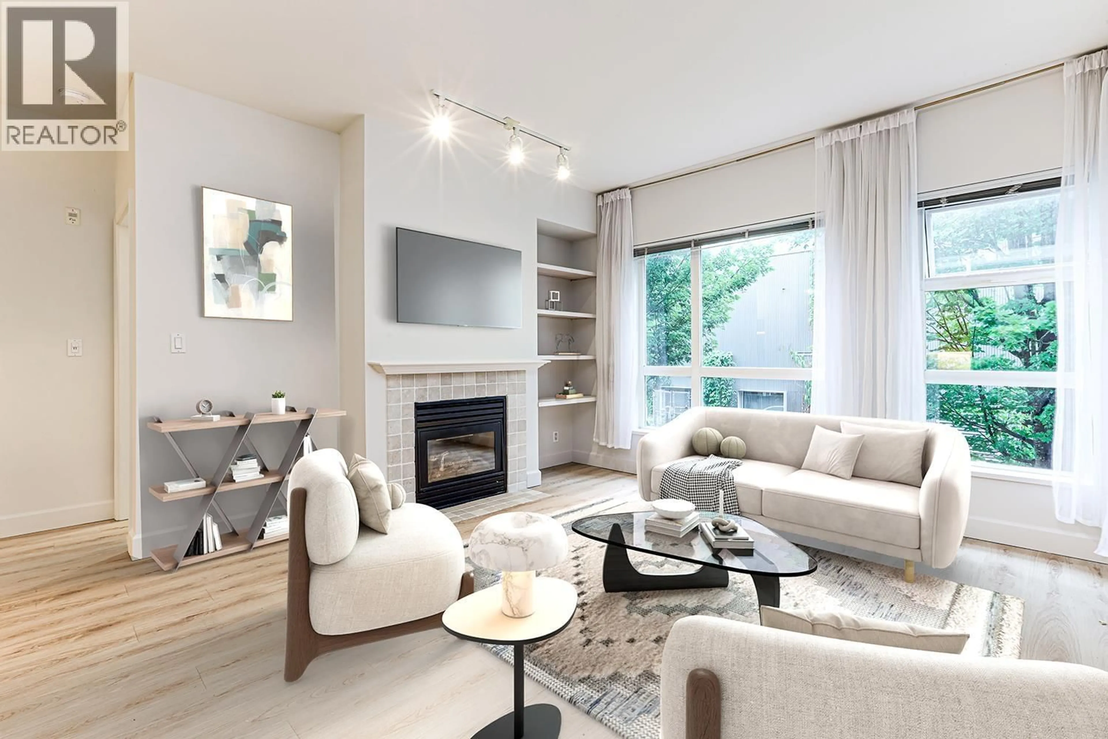 Living room with furniture, wood/laminate floor for 211 - 6198 ASH STREET, Vancouver British Columbia V5Z3G9