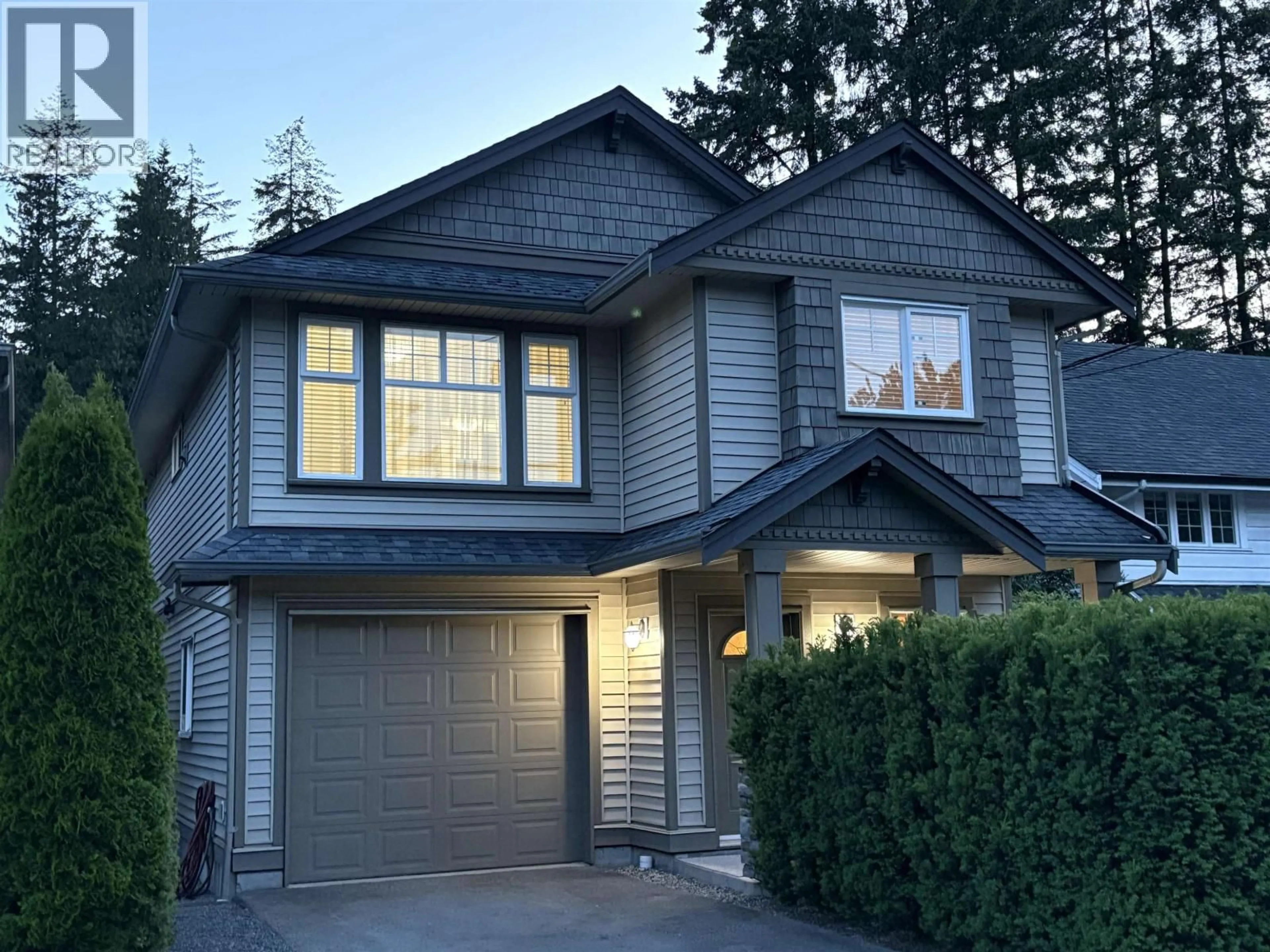 Home with vinyl exterior material, street for 347 SEYMOUR RIVER PLACE, North Vancouver British Columbia V7H1S6