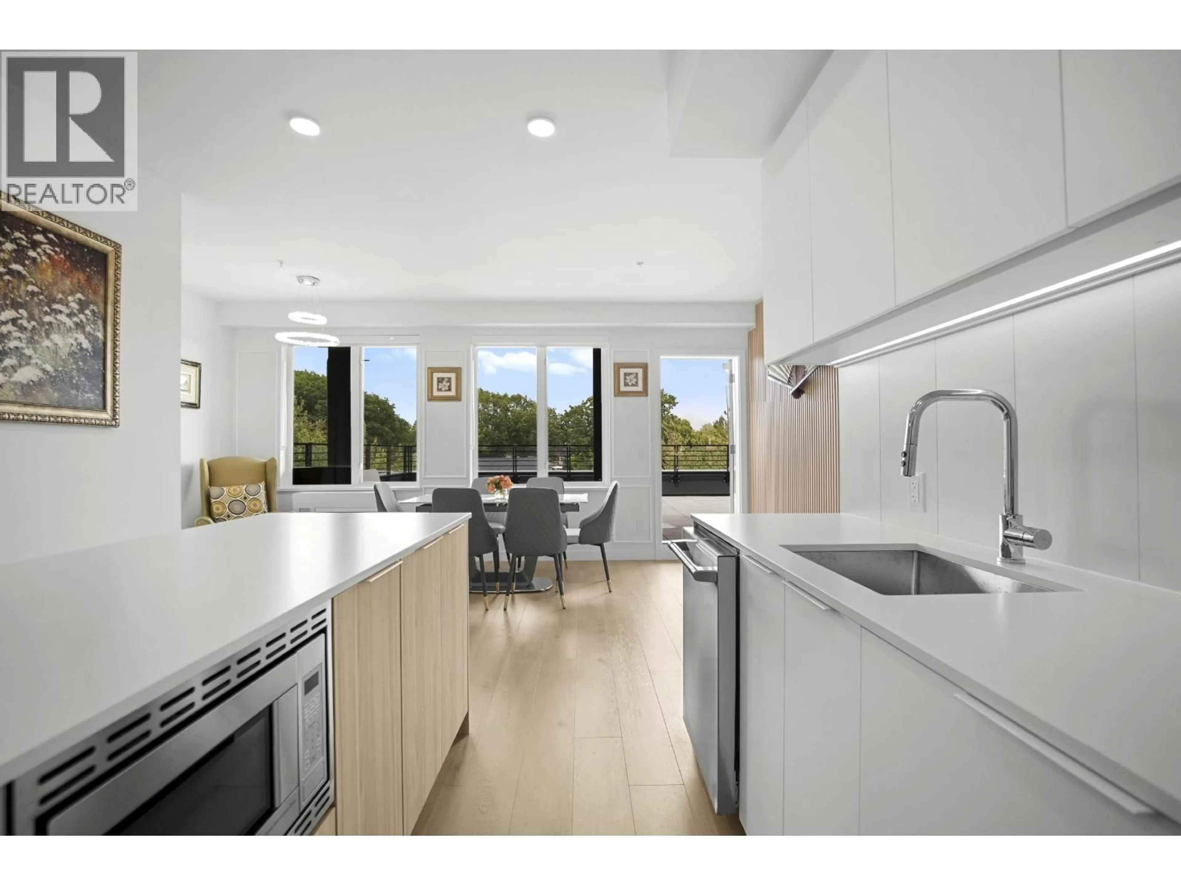 Open concept kitchen, ceramic/tile floor for 505 - 2450 GARDEN DRIVE, Vancouver British Columbia V5N0K1
