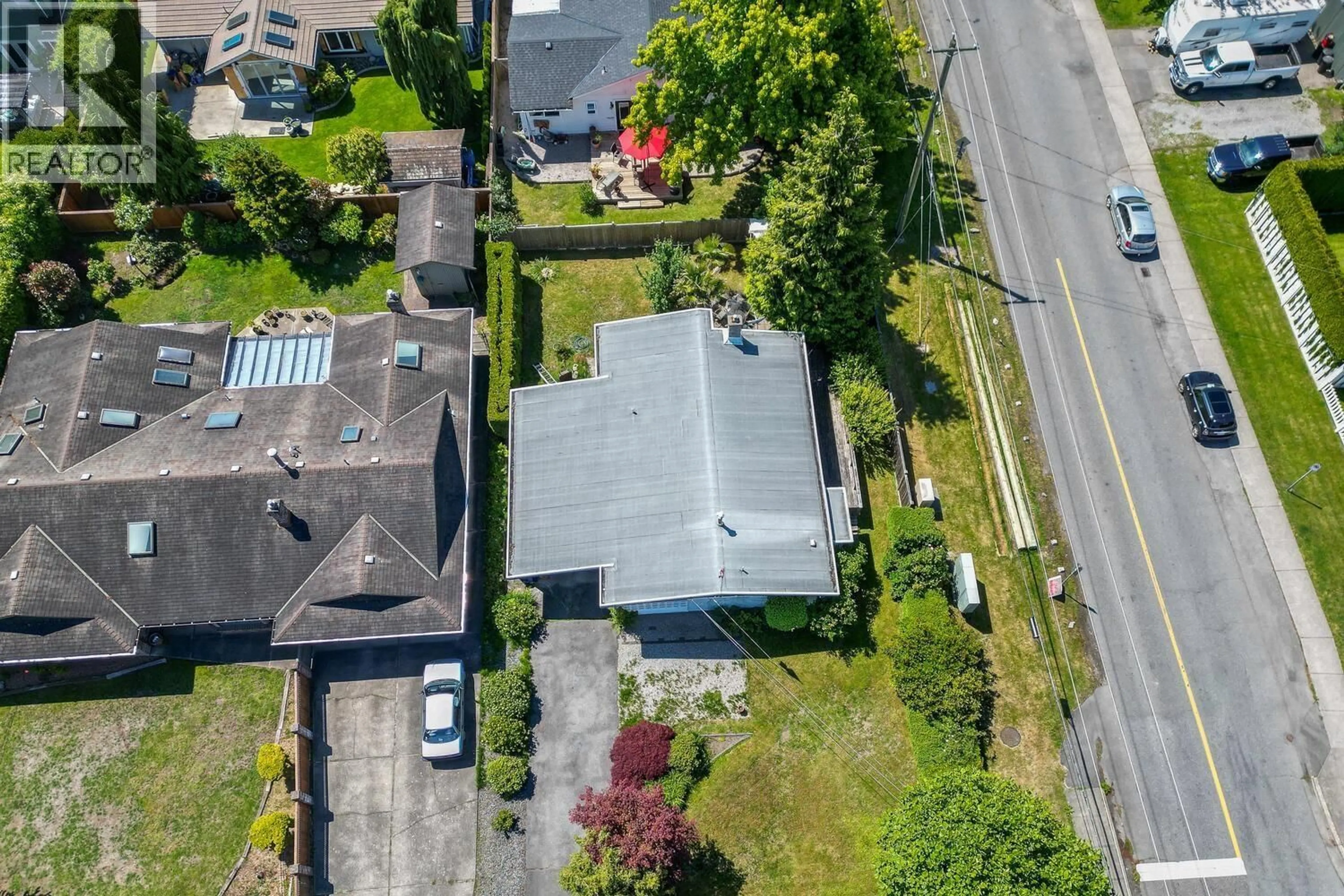A pic from outside/outdoor area/front of a property/back of a property/a pic from drone, street for 5086 12 AVENUE, Delta British Columbia V4M2A8