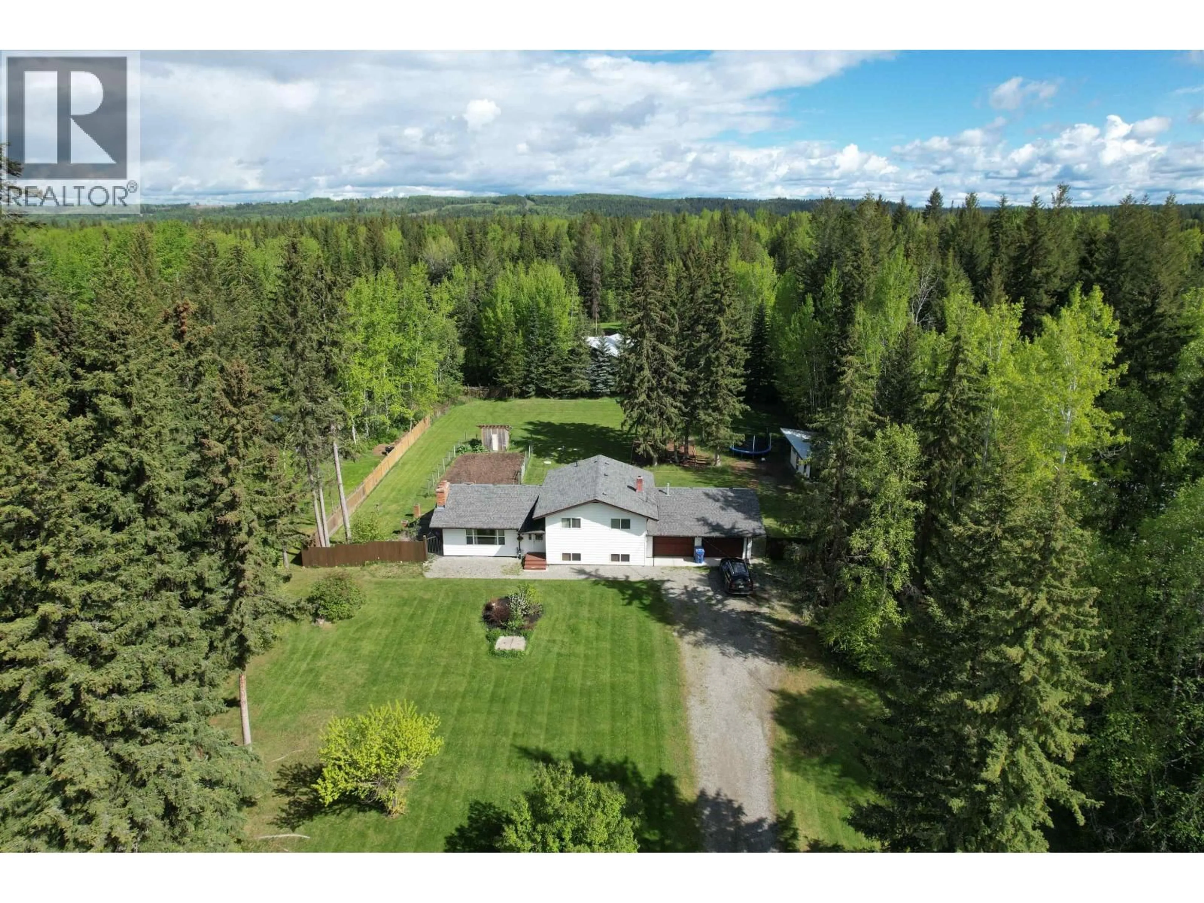 A pic from outside/outdoor area/front of a property/back of a property/a pic from drone, forest/trees view for 721 SERENITY DRIVE, Quesnel British Columbia V2J6W3