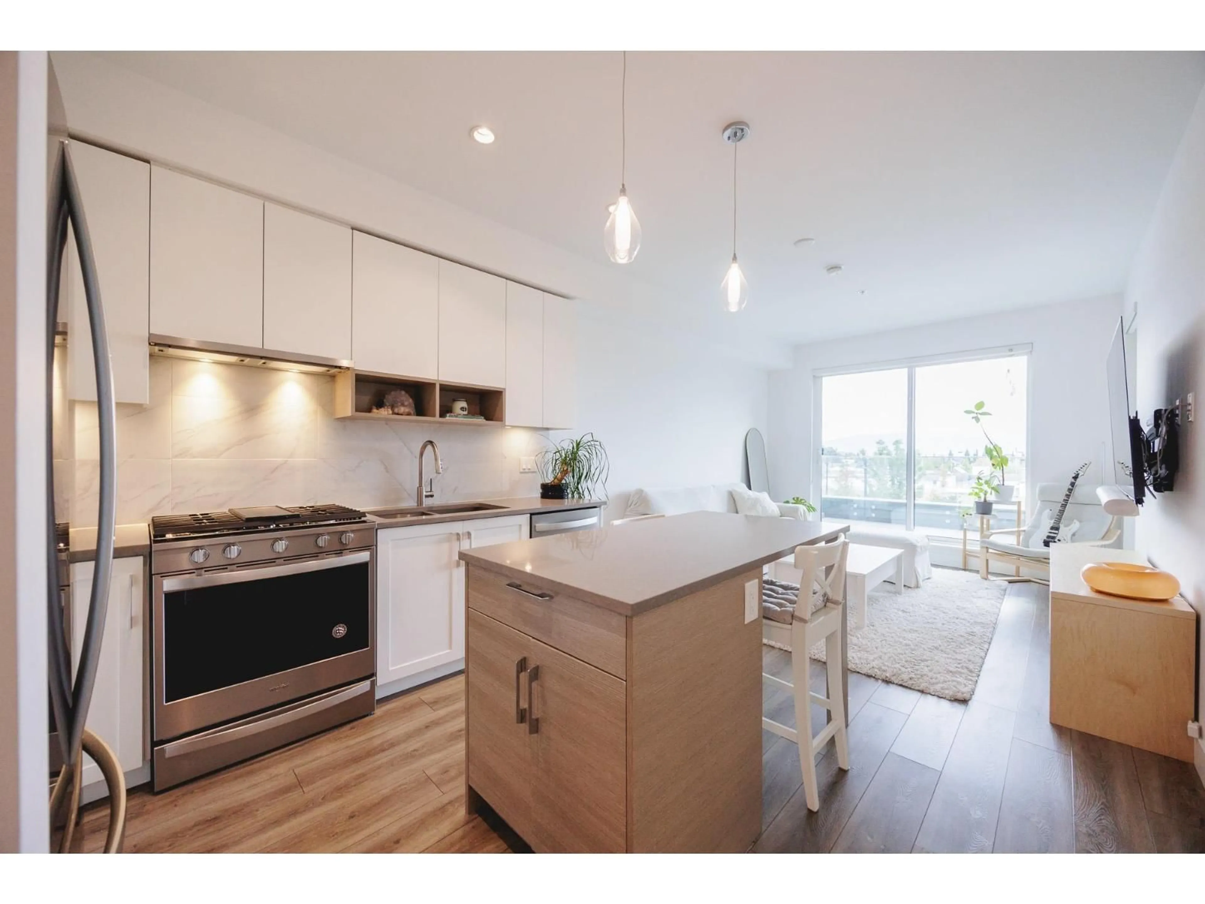 Open concept kitchen, wood/laminate floor for A224 - 20727 WILLOUGHBY TOWN CENTRE, Langley British Columbia V2Y3N1