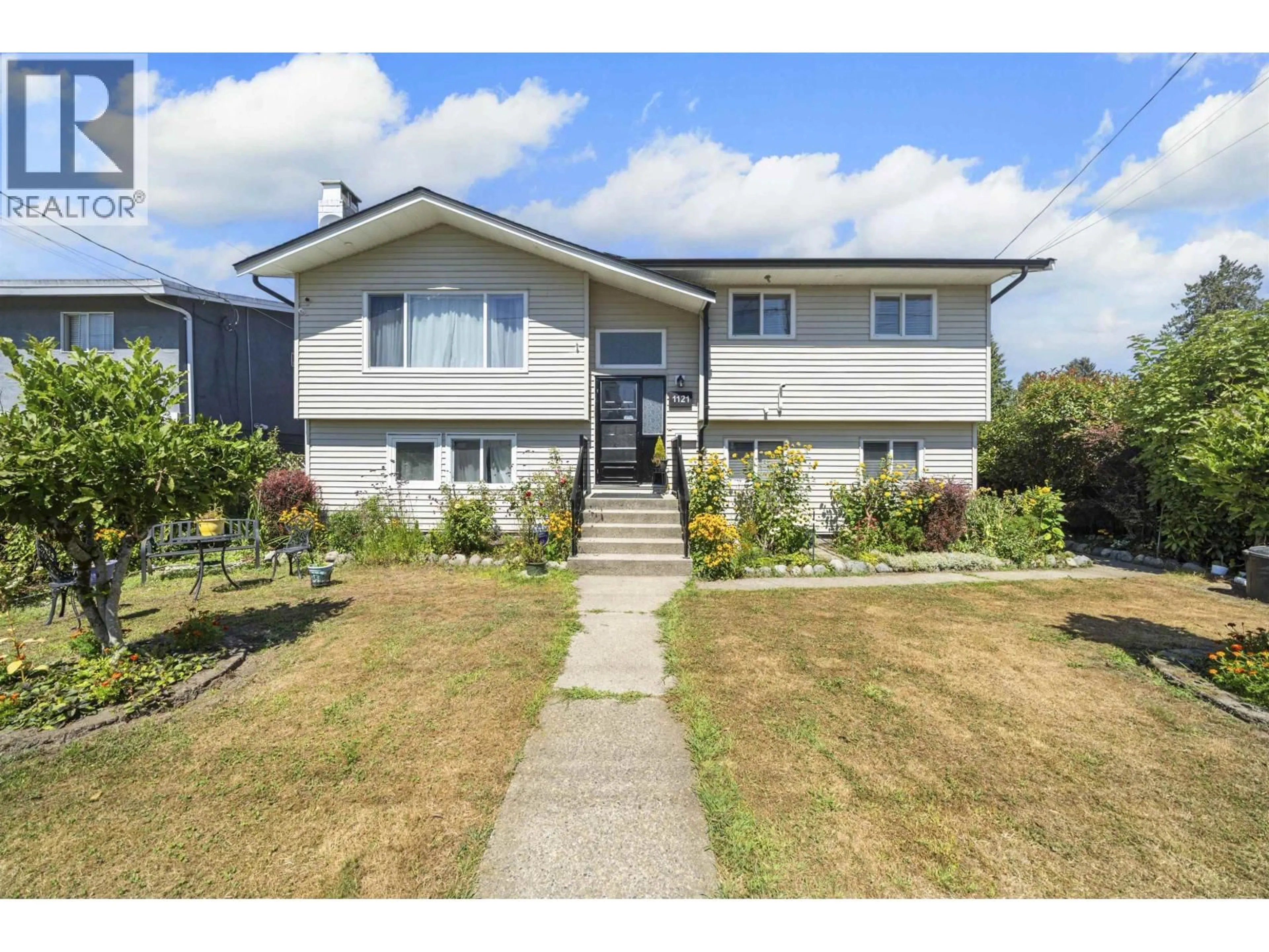 Home with vinyl exterior material, street for 1121 PRAIRIE AVENUE, Port Coquitlam British Columbia V3B1S7