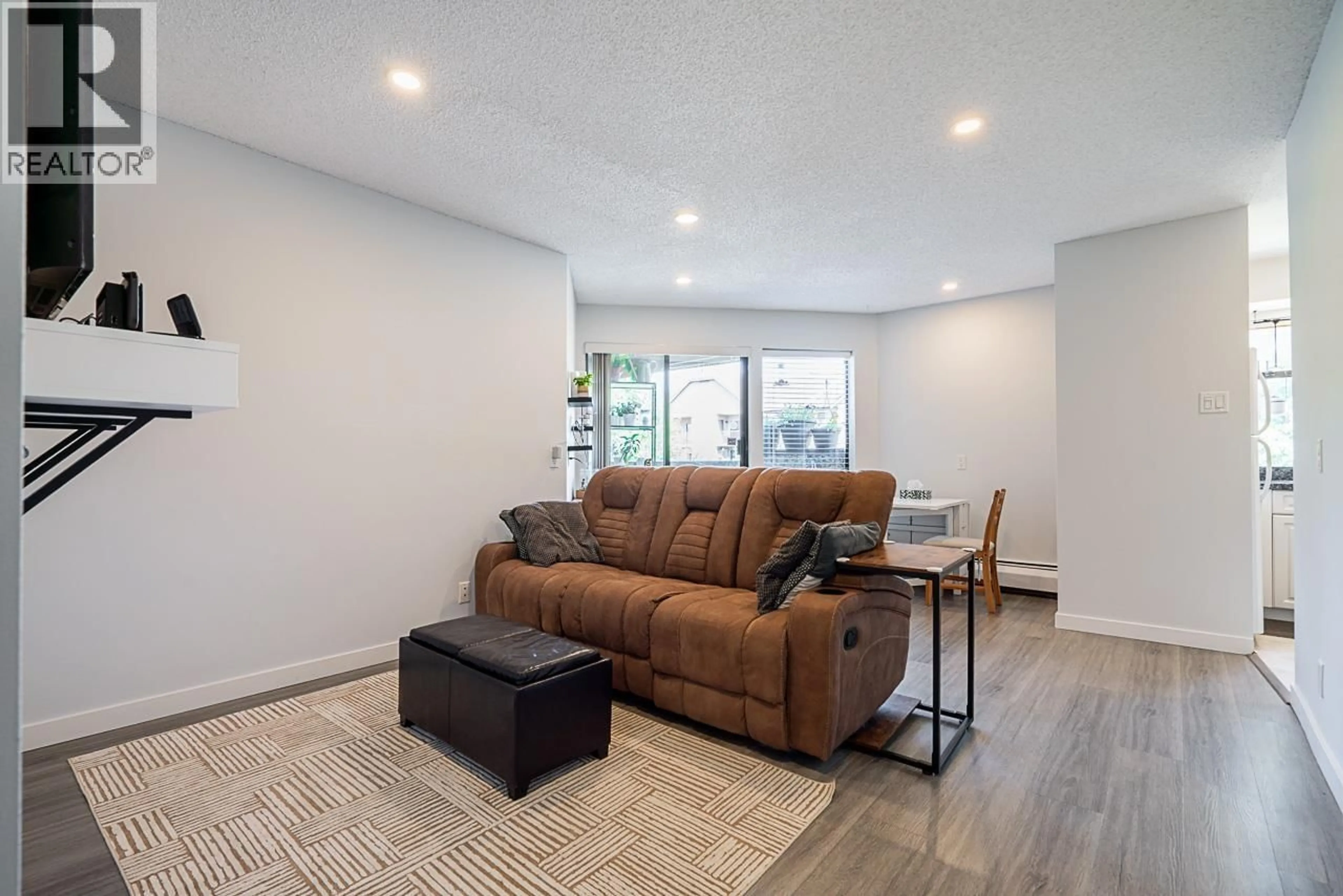 Living room with furniture, wood/laminate floor for 204 - 8451 WESTMINSTER HIGHWAY, Richmond British Columbia V6X3E4