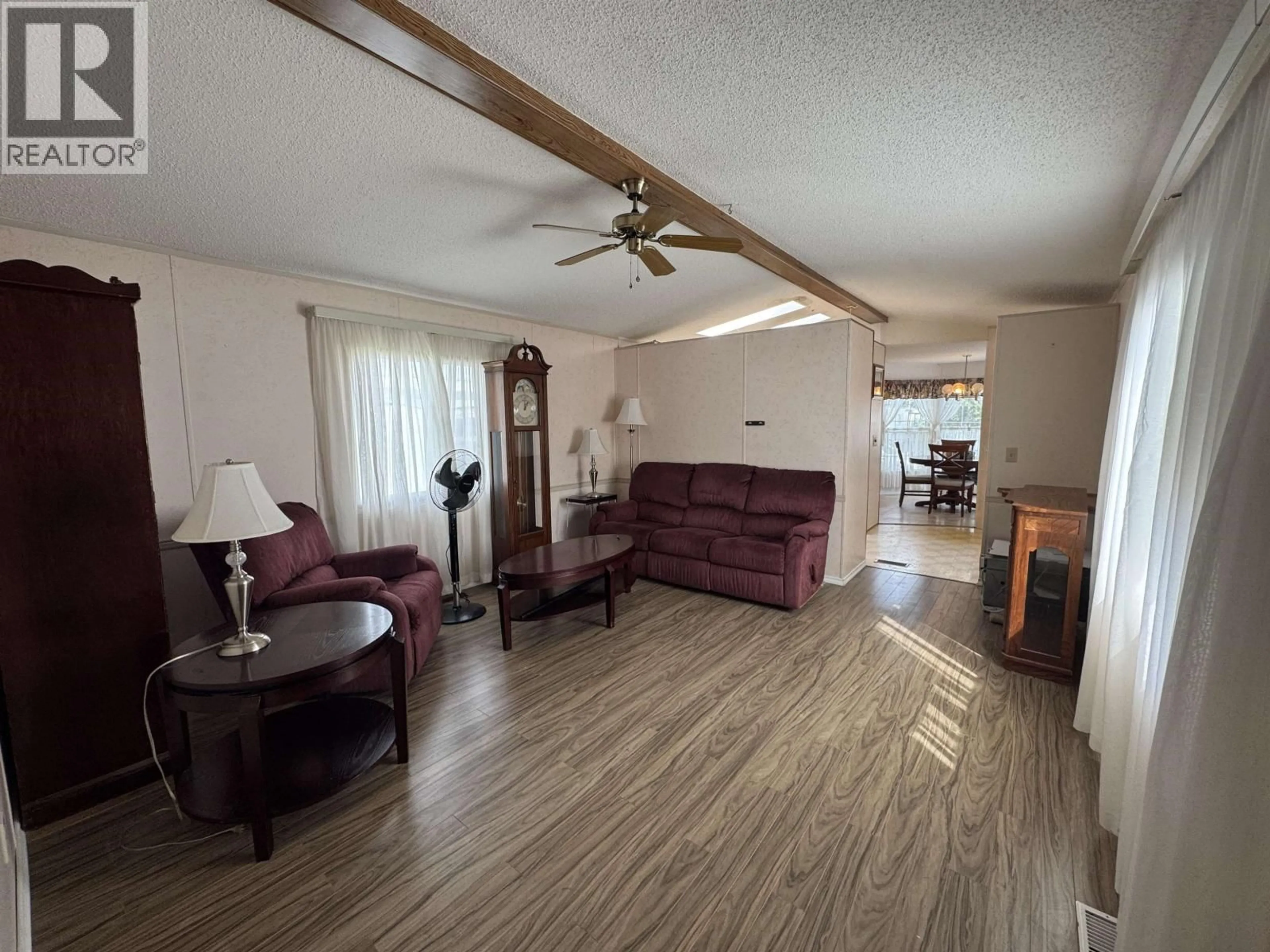 Living room with furniture, wood/laminate floor for 119 - 7817 97 HWY S HIGHWAY, Prince George British Columbia V2N6P6