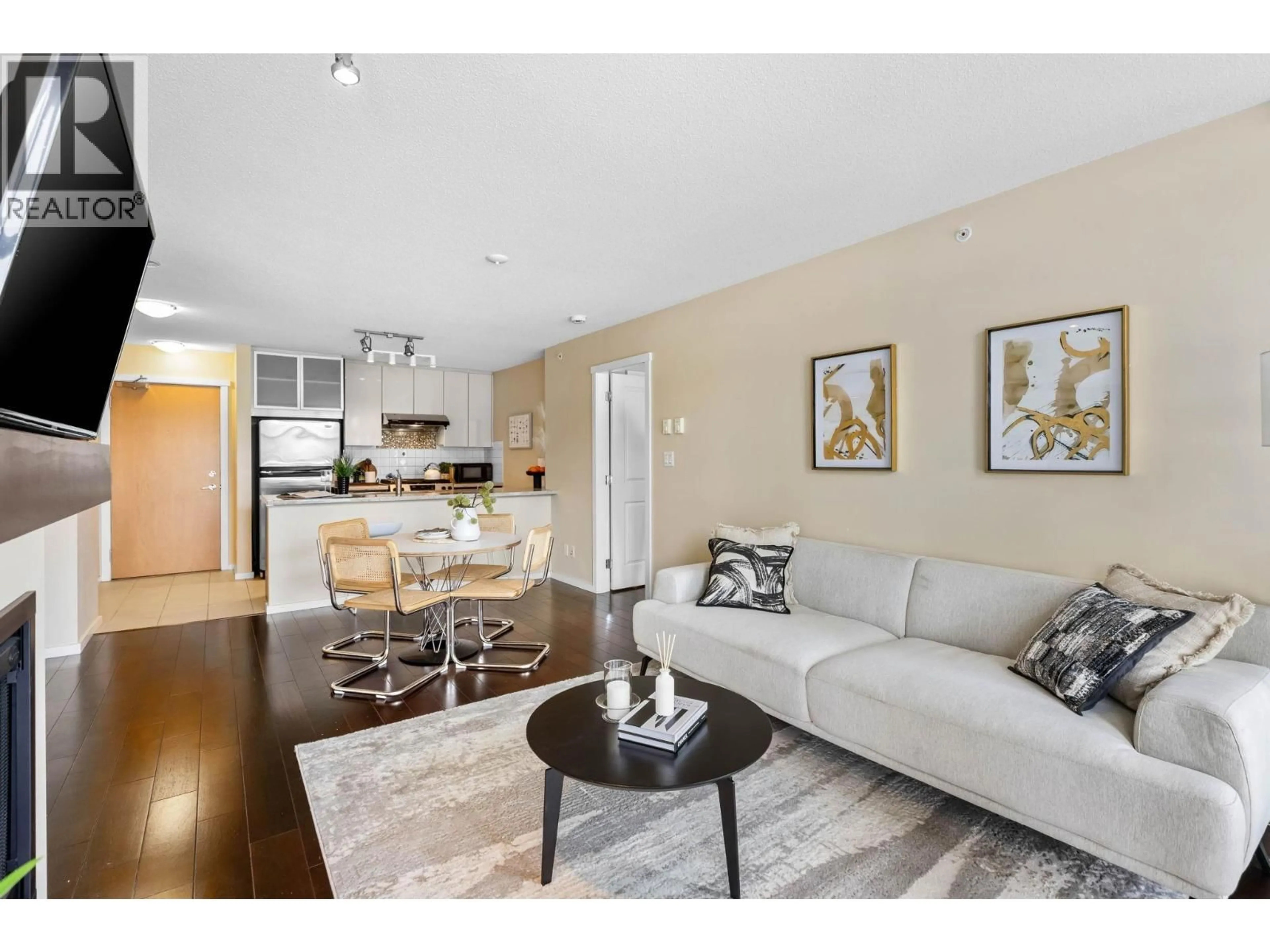 Living room with furniture, wood/laminate floor for 1102 - 2289 YUKON CRESCENT, Burnaby British Columbia V5C0B2