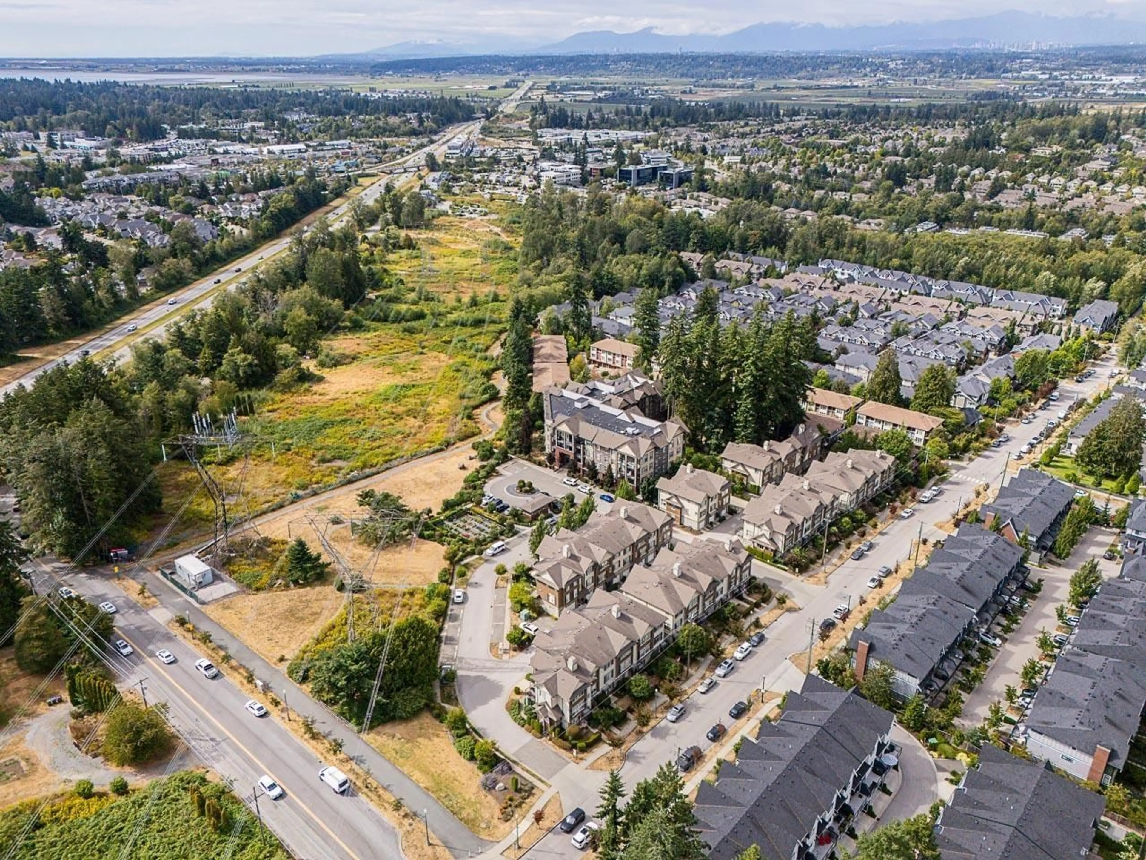 A pic from outside/outdoor area/front of a property/back of a property/a pic from drone, mountain view for 306 - 2855 156, Surrey British Columbia V3Z3Y3