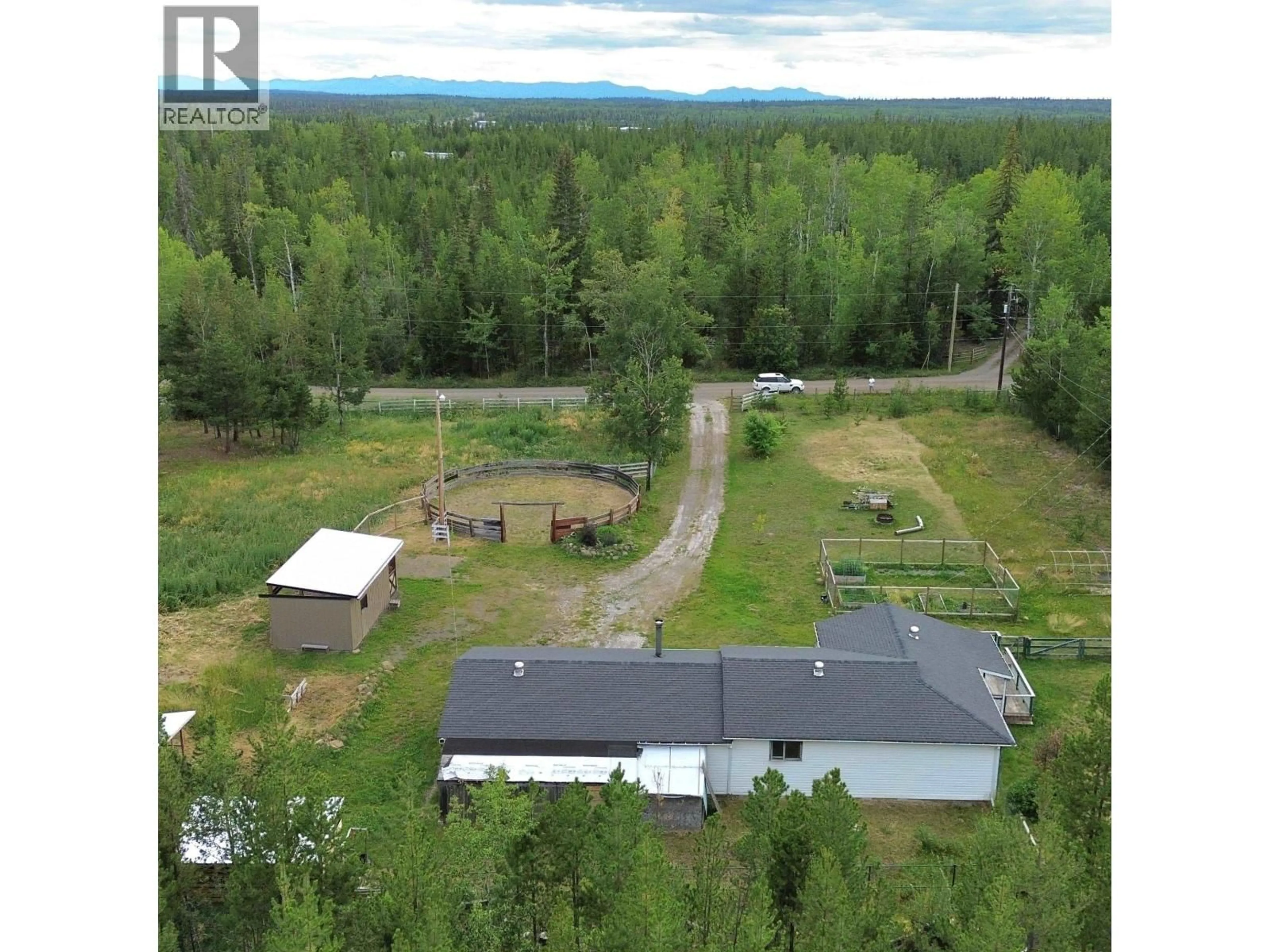 A pic from outside/outdoor area/front of a property/back of a property/a pic from drone, unknown for 6813 SWELANDER ROAD, 100 Mile House British Columbia V0K2E2