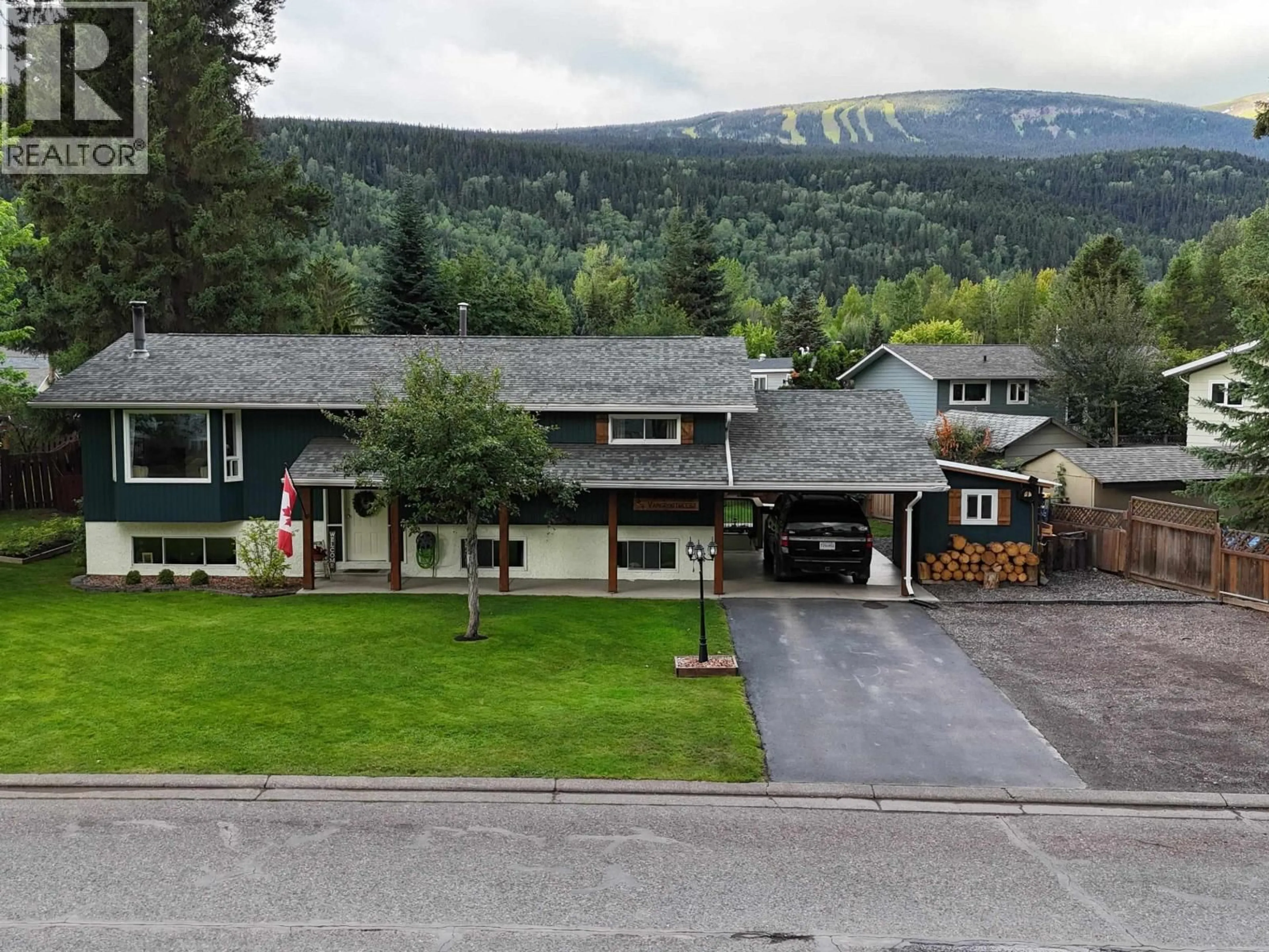 A pic from outside/outdoor area/front of a property/back of a property/a pic from drone, mountain view for 4381 BIRCH CRESCENT, Smithers British Columbia V0J2N0