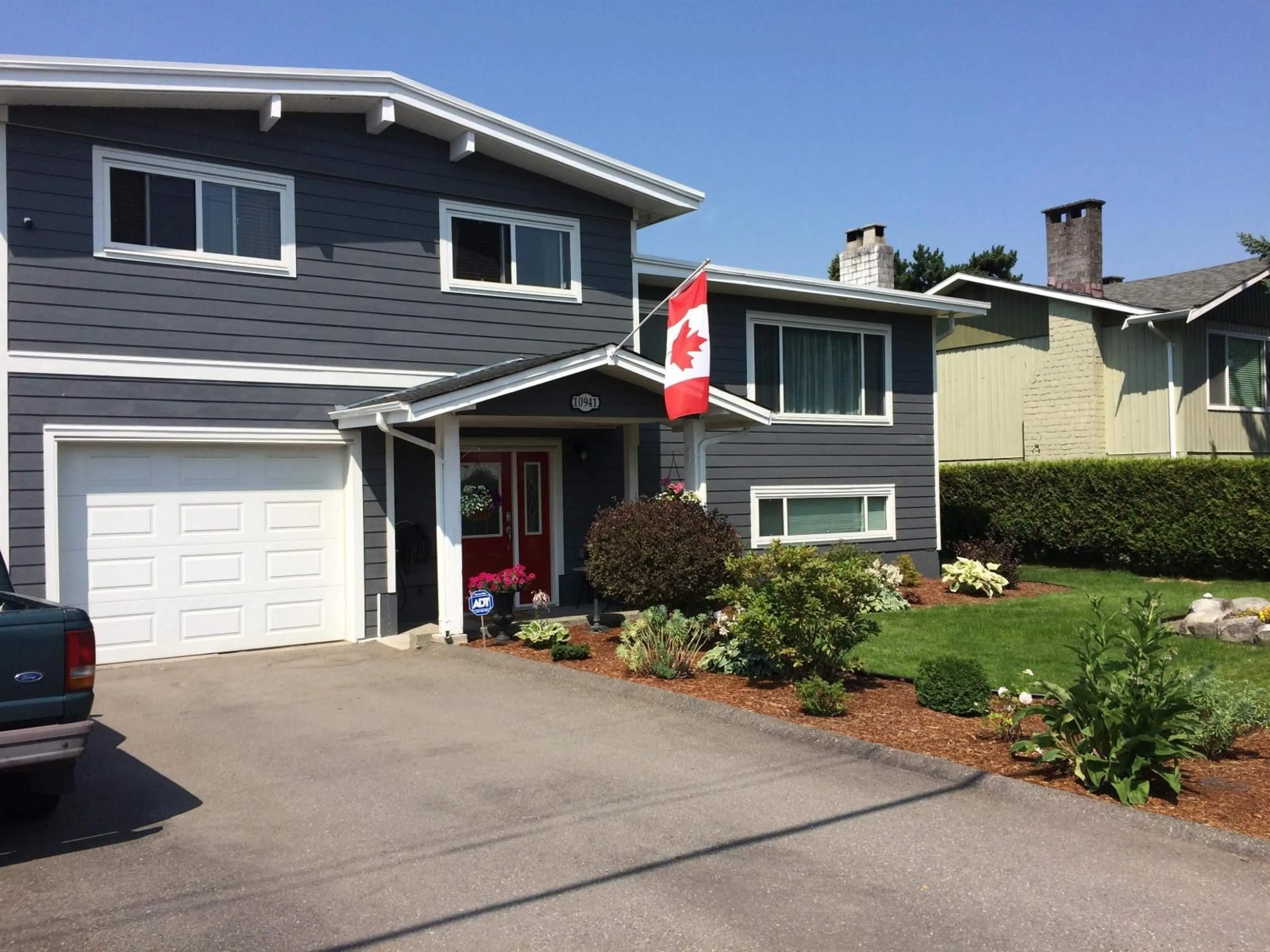 Home with vinyl exterior material, street for 10941 152ND, Surrey British Columbia V3R4H5