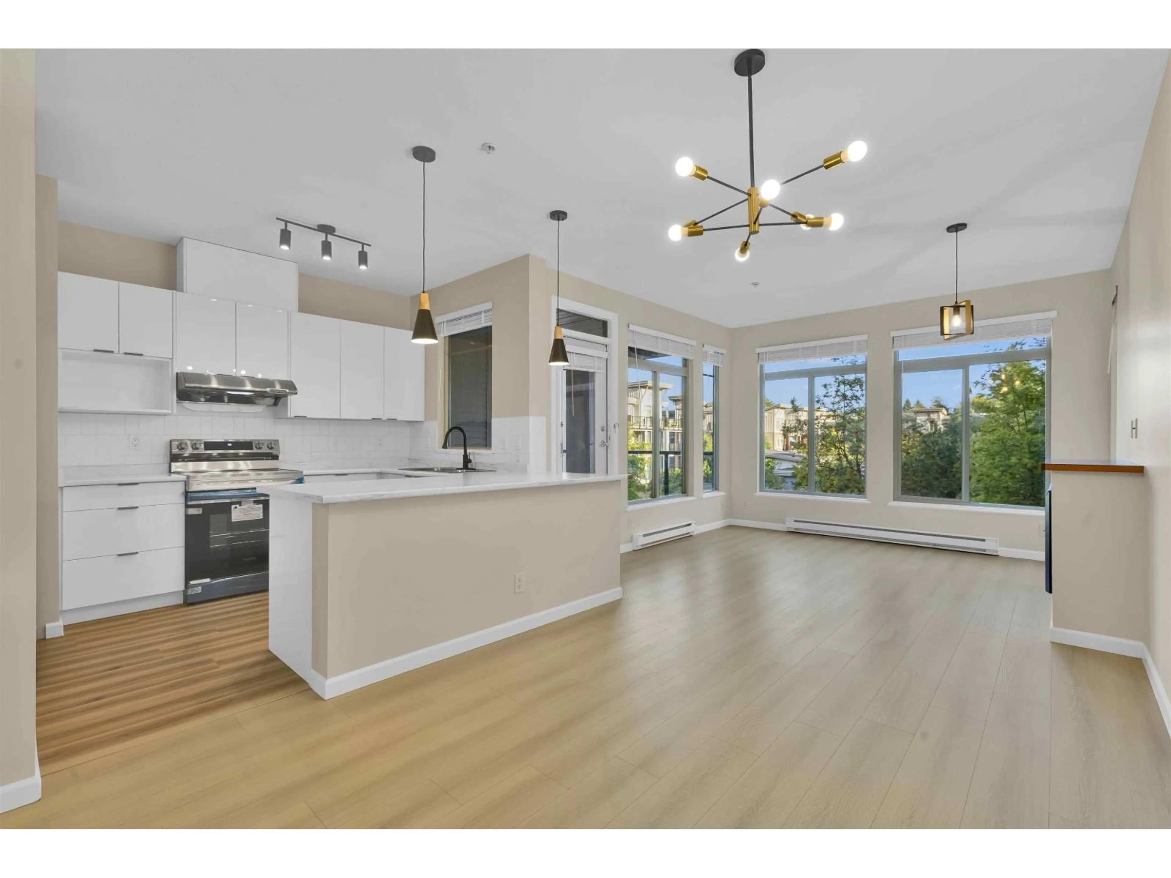 Open concept kitchen, wood/laminate floor for 302 - 15380 102A, Surrey British Columbia V3R0B3
