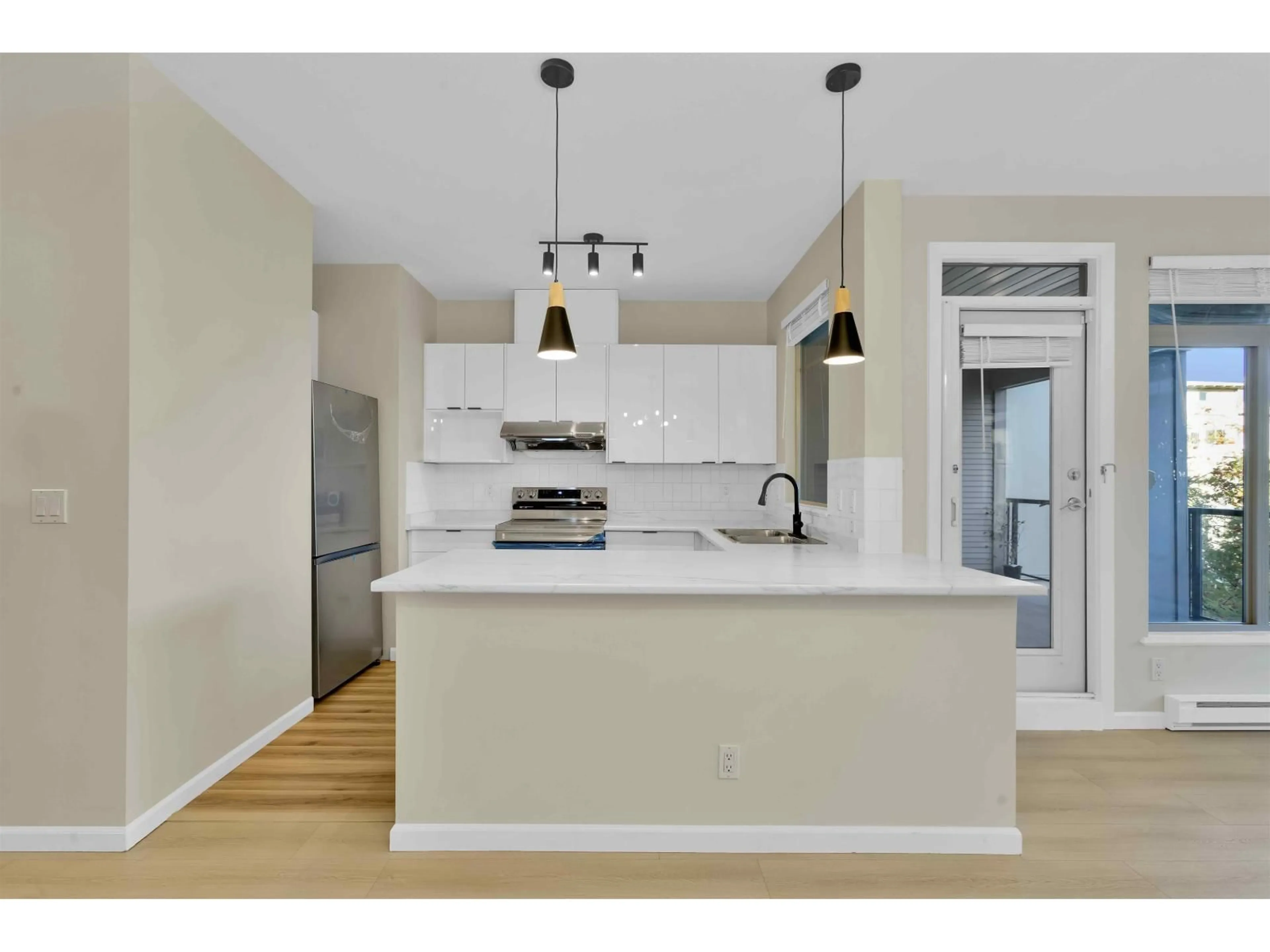 Open concept kitchen, unknown for 302 - 15380 102A, Surrey British Columbia V3R0B3