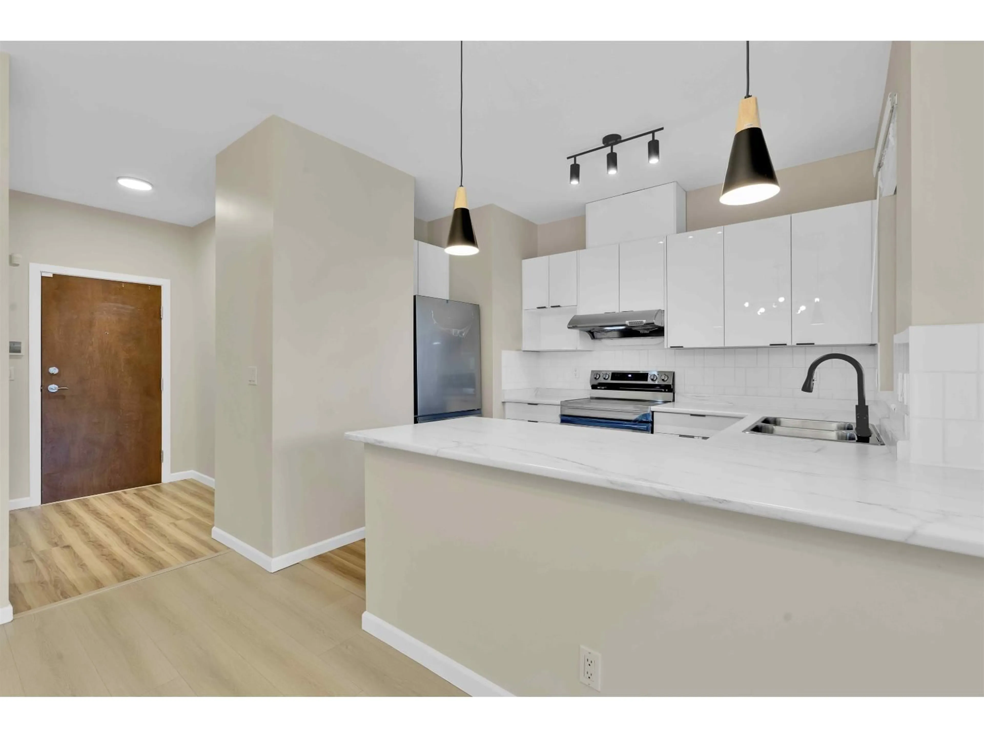 Open concept kitchen, unknown for 302 - 15380 102A, Surrey British Columbia V3R0B3