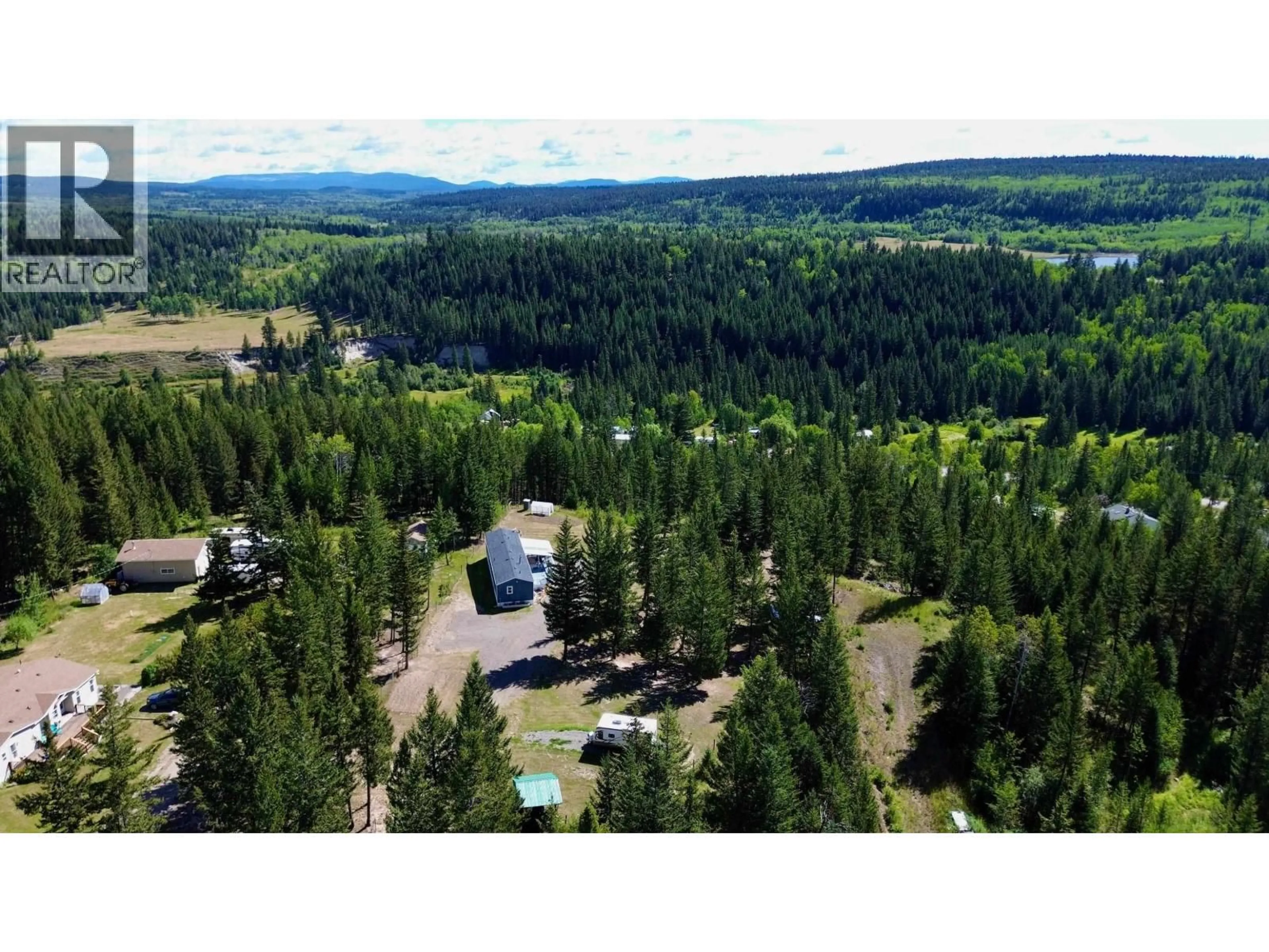 A pic from outside/outdoor area/front of a property/back of a property/a pic from drone, forest/trees view for 5581 BIRCHWOOD ROAD, 100 Mile House British Columbia V0K2E0