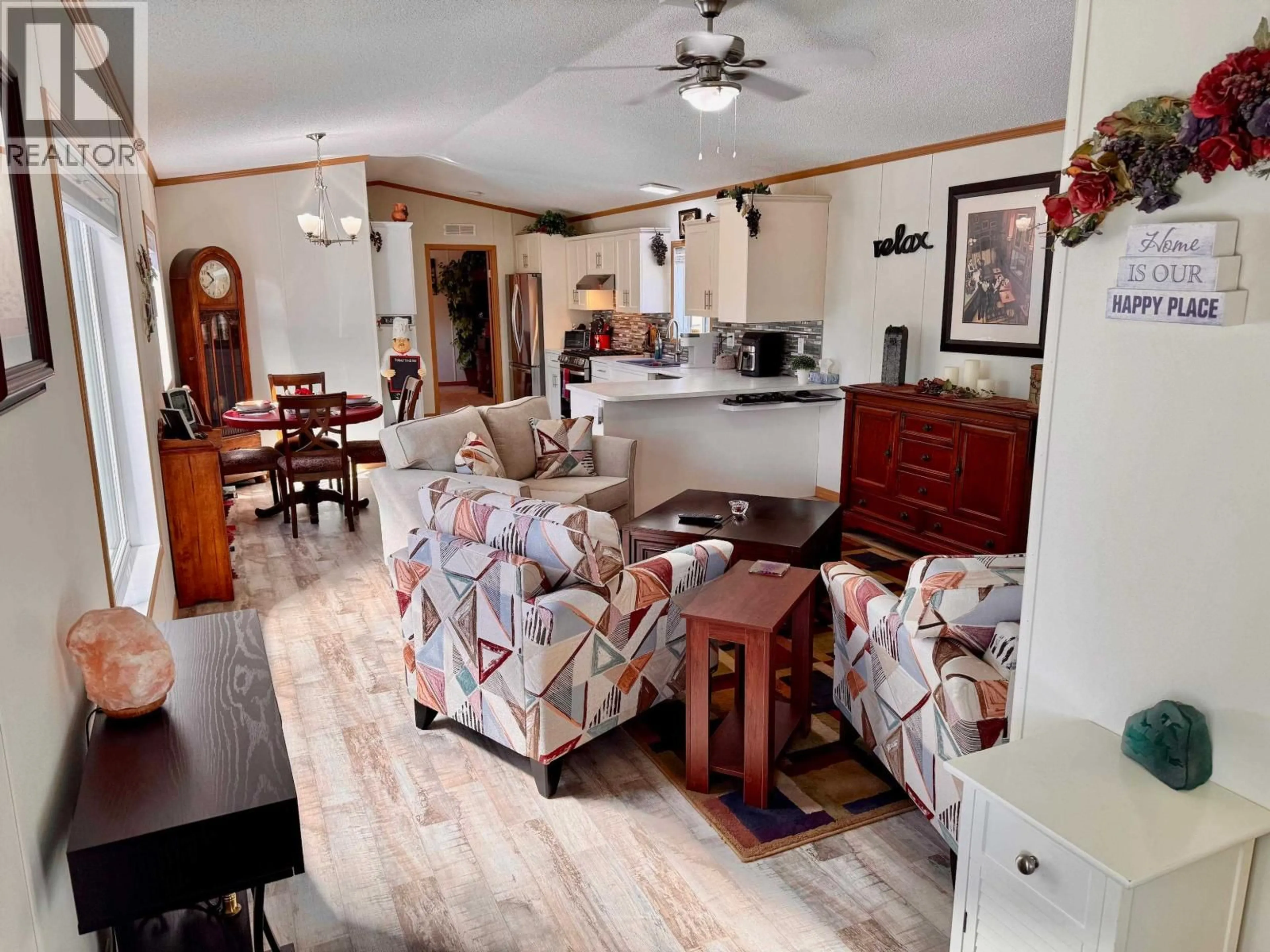 Living room with furniture, unknown for 5581 BIRCHWOOD ROAD, 100 Mile House British Columbia V0K2E0