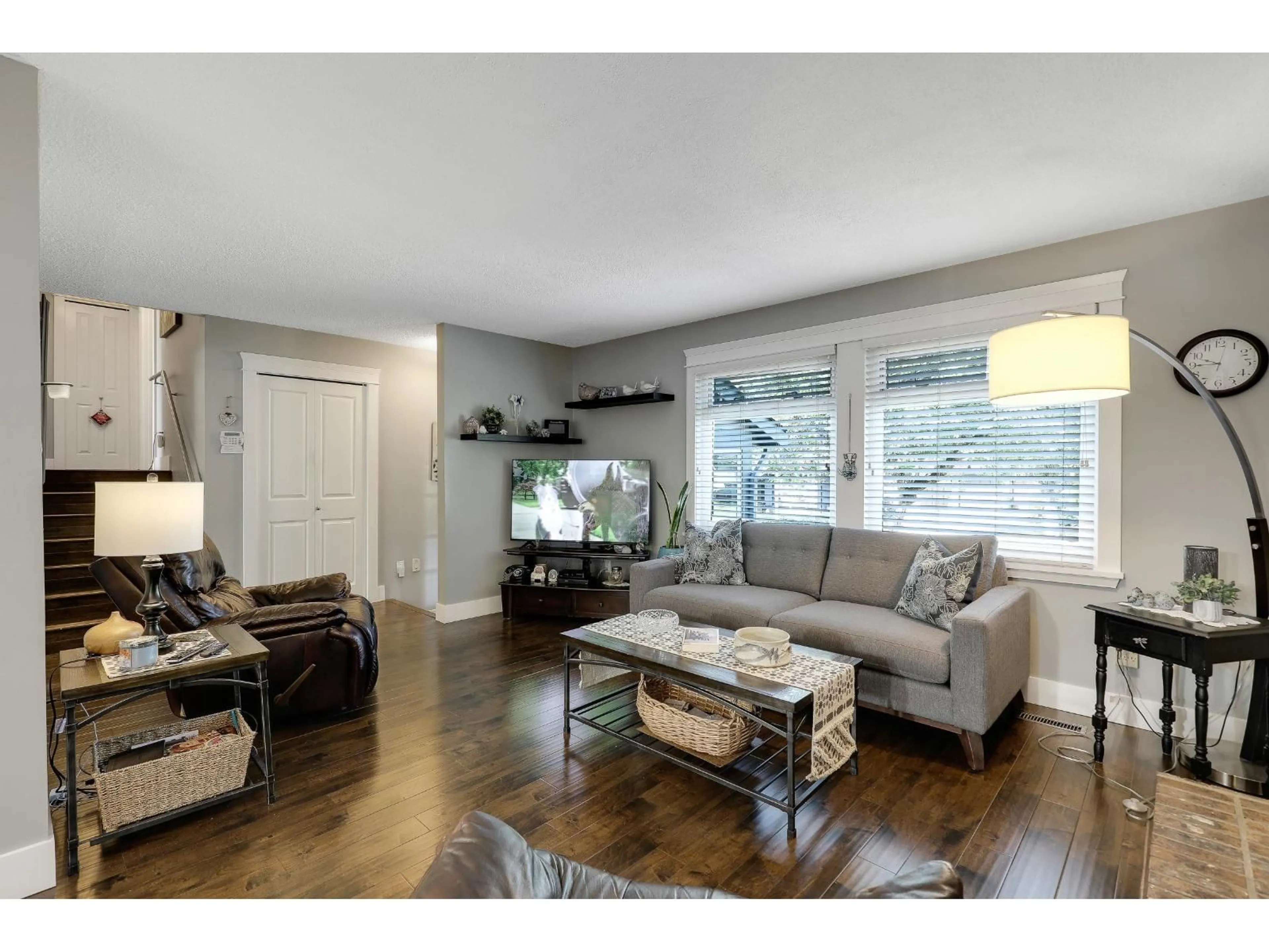 Living room with furniture, wood/laminate floor for 6306 195, Surrey British Columbia V3S7L9