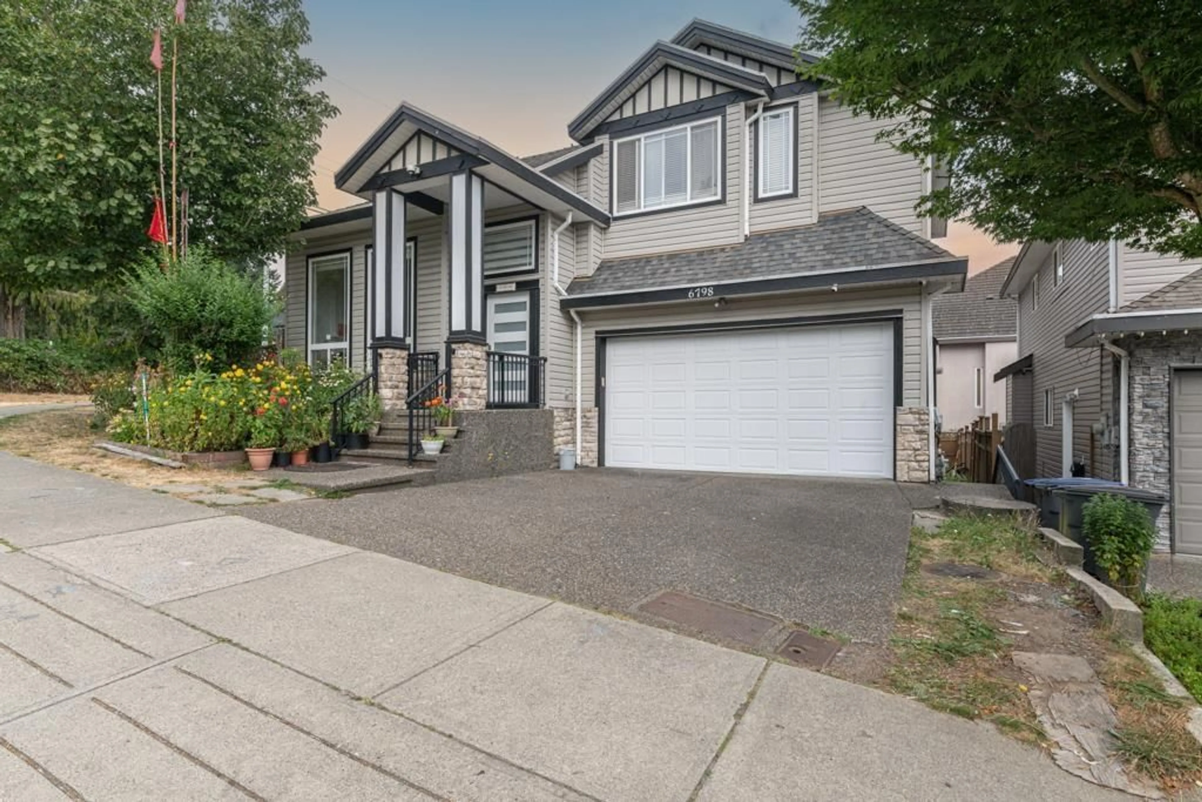 Home with vinyl exterior material, street for 6798 146B, Surrey British Columbia V3S0Z4