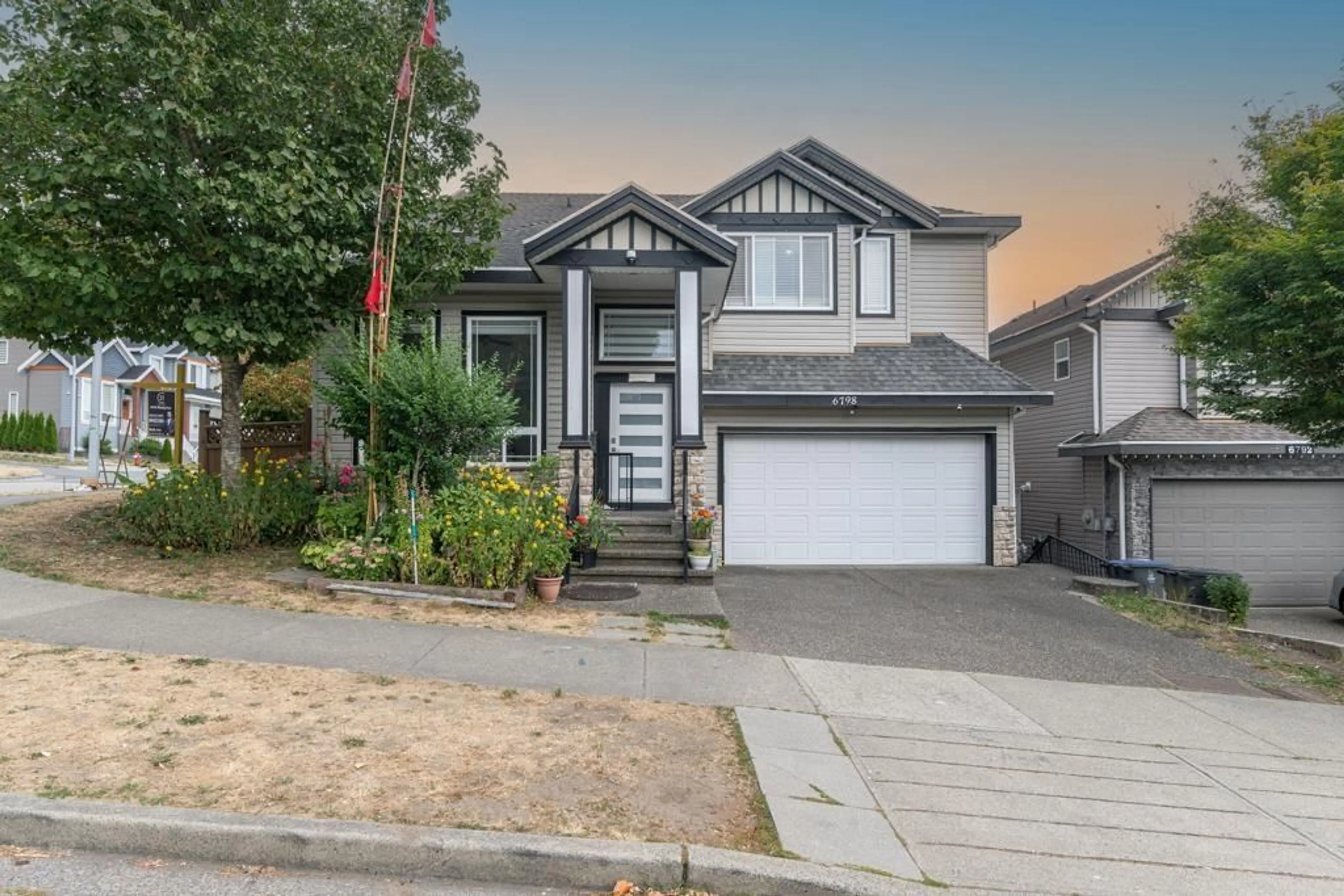 Home with vinyl exterior material, street for 6798 146B, Surrey British Columbia V3S0Z4