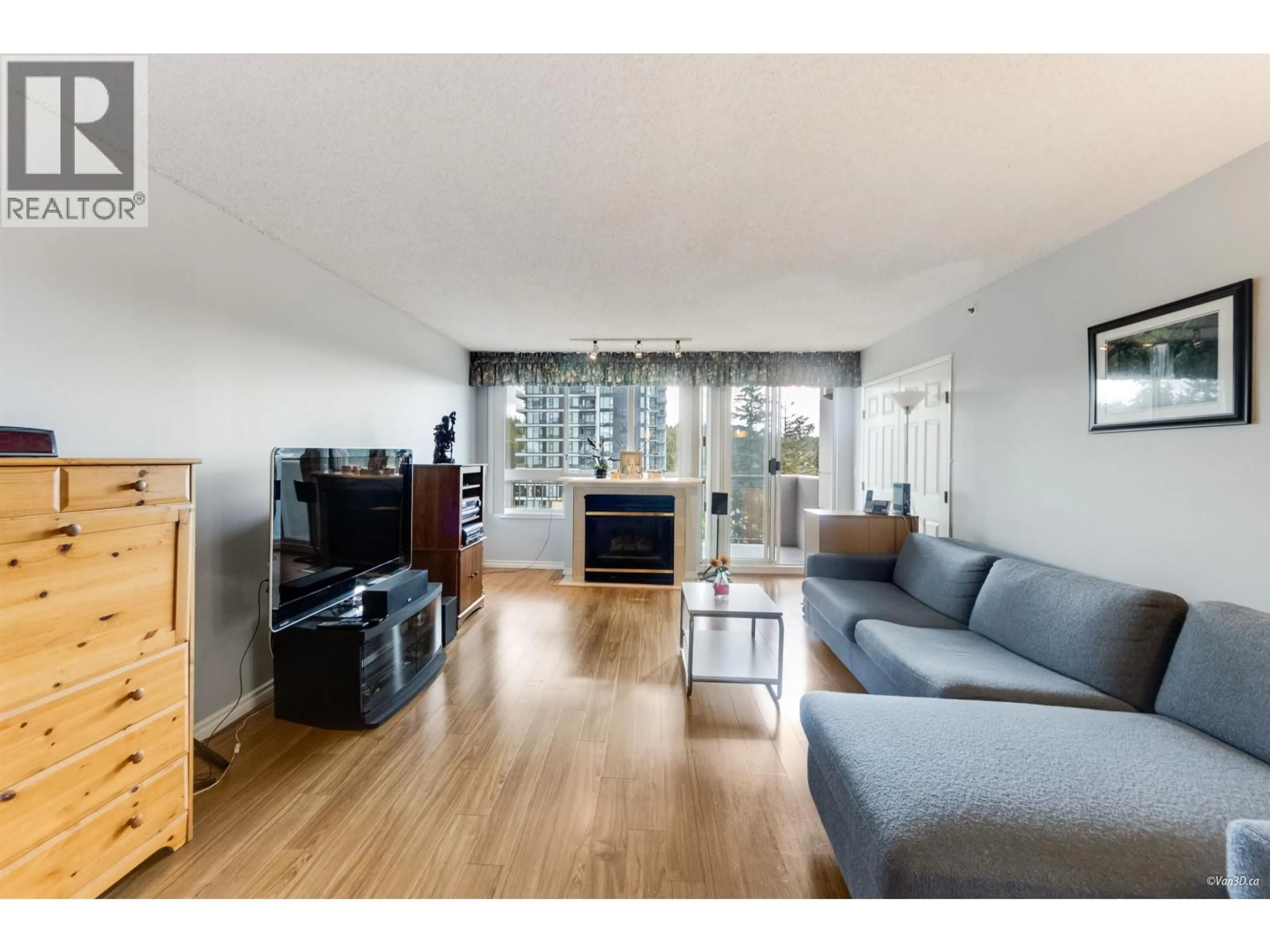 Living room with furniture, wood/laminate floor for 1404 - 555 AUSTIN AVENUE, Coquitlam British Columbia V3K6R8