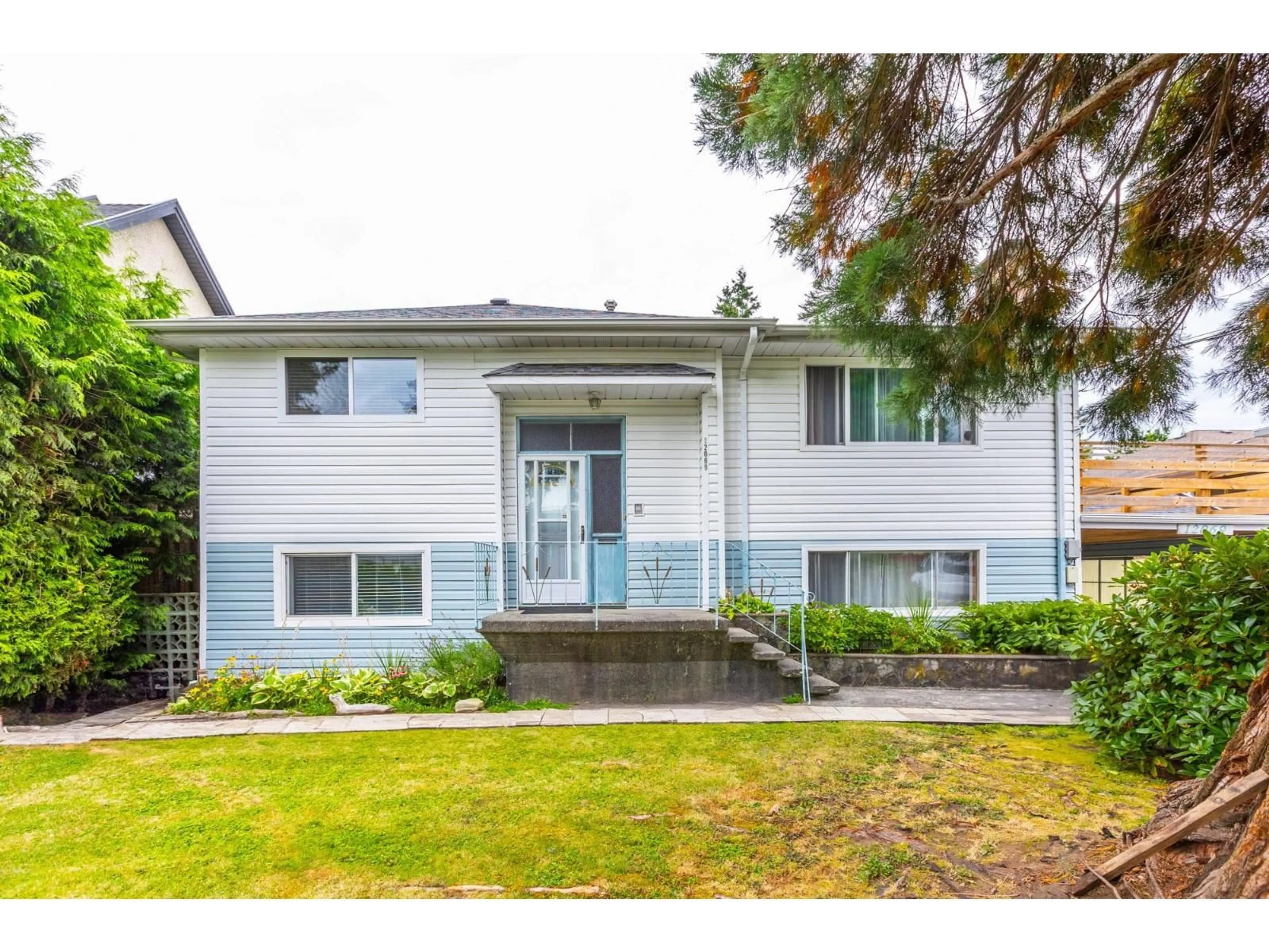 Home with vinyl exterior material, street for 12069 97, Surrey British Columbia V3V2C7