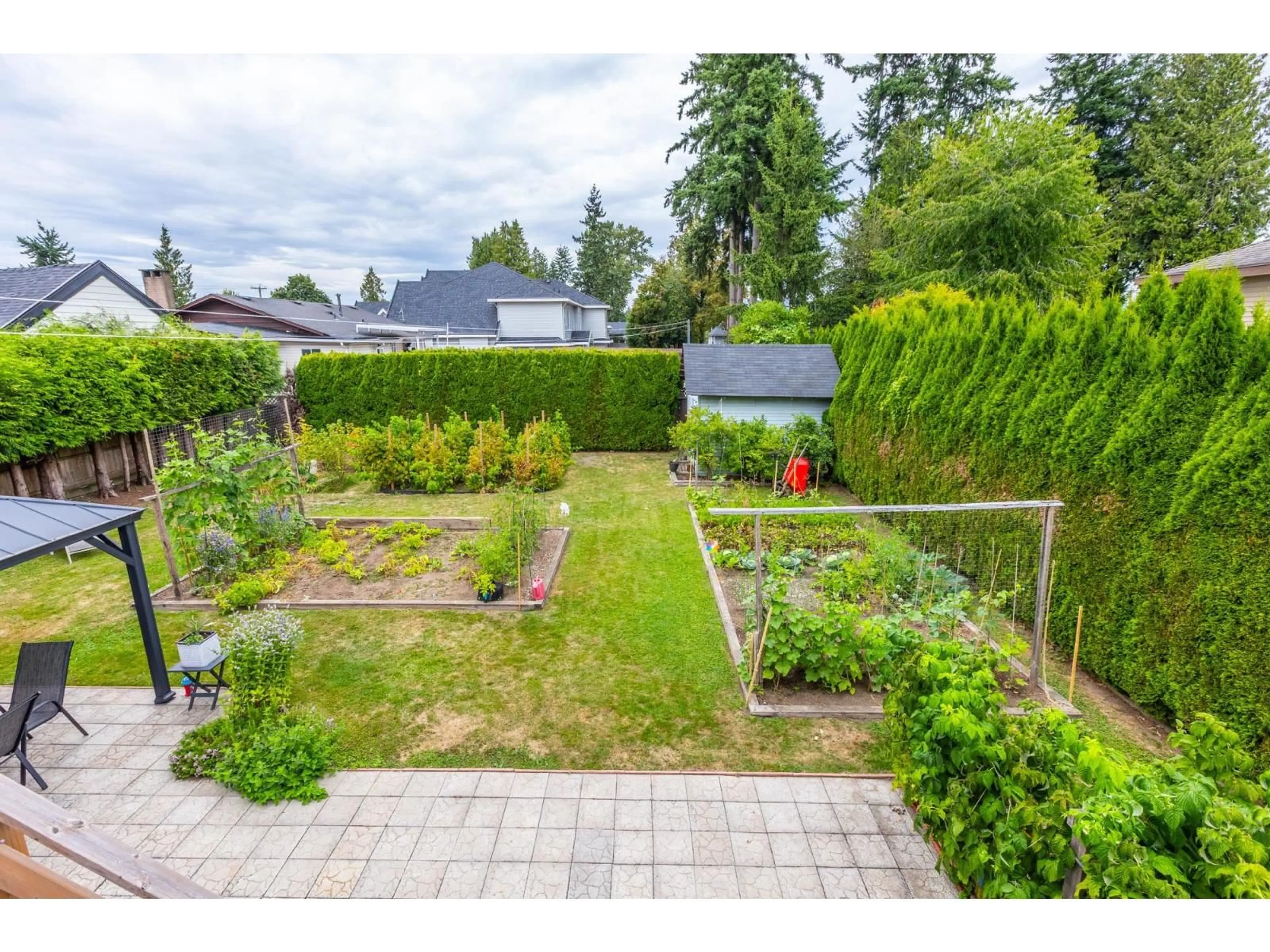 A pic from outside/outdoor area/front of a property/back of a property/a pic from drone, street for 12069 97, Surrey British Columbia V3V2C7