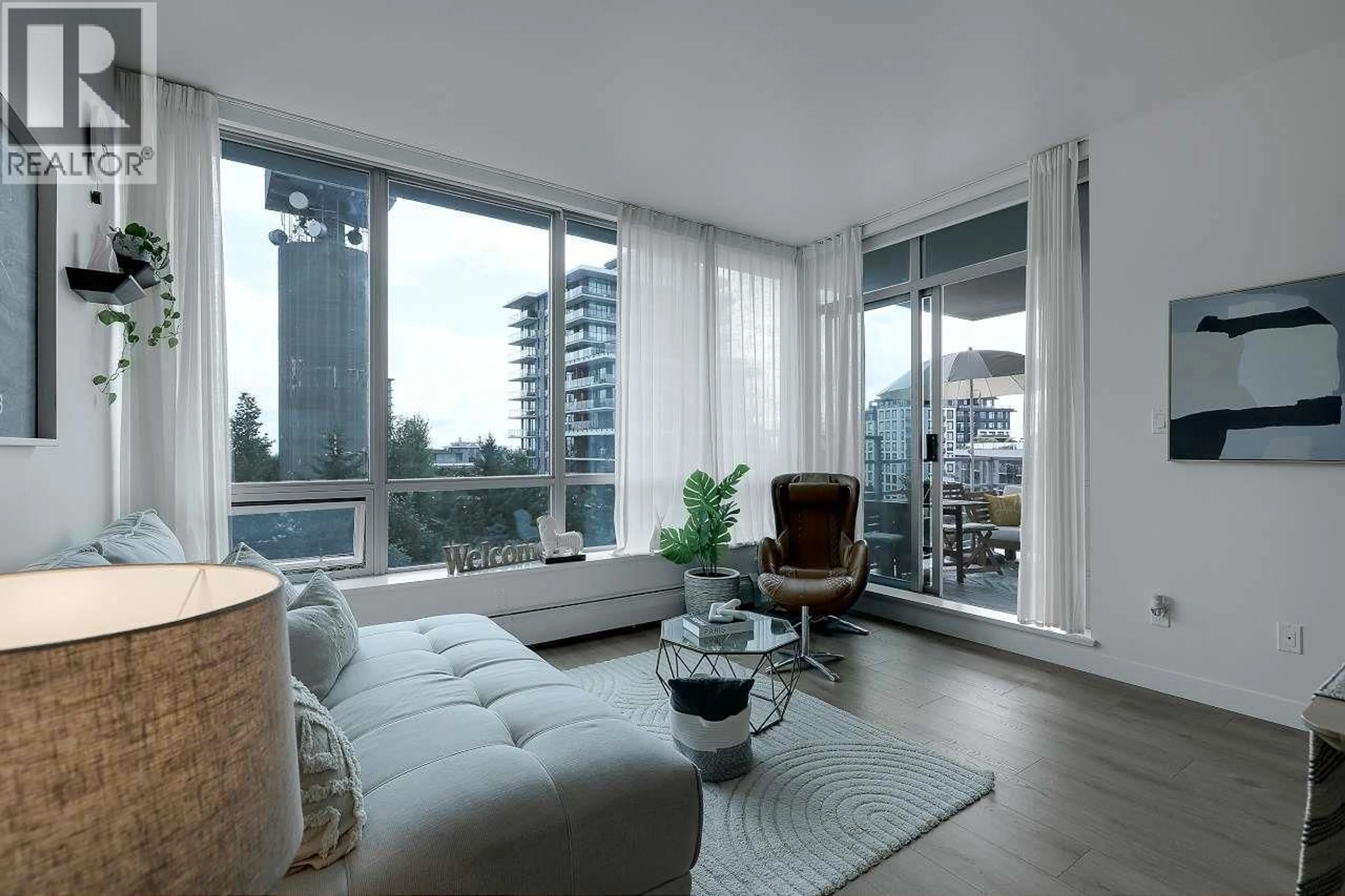 Living room with furniture, unknown for 803 - 9060 UNIVERSITY CRESCENT, Burnaby British Columbia V5A0E1