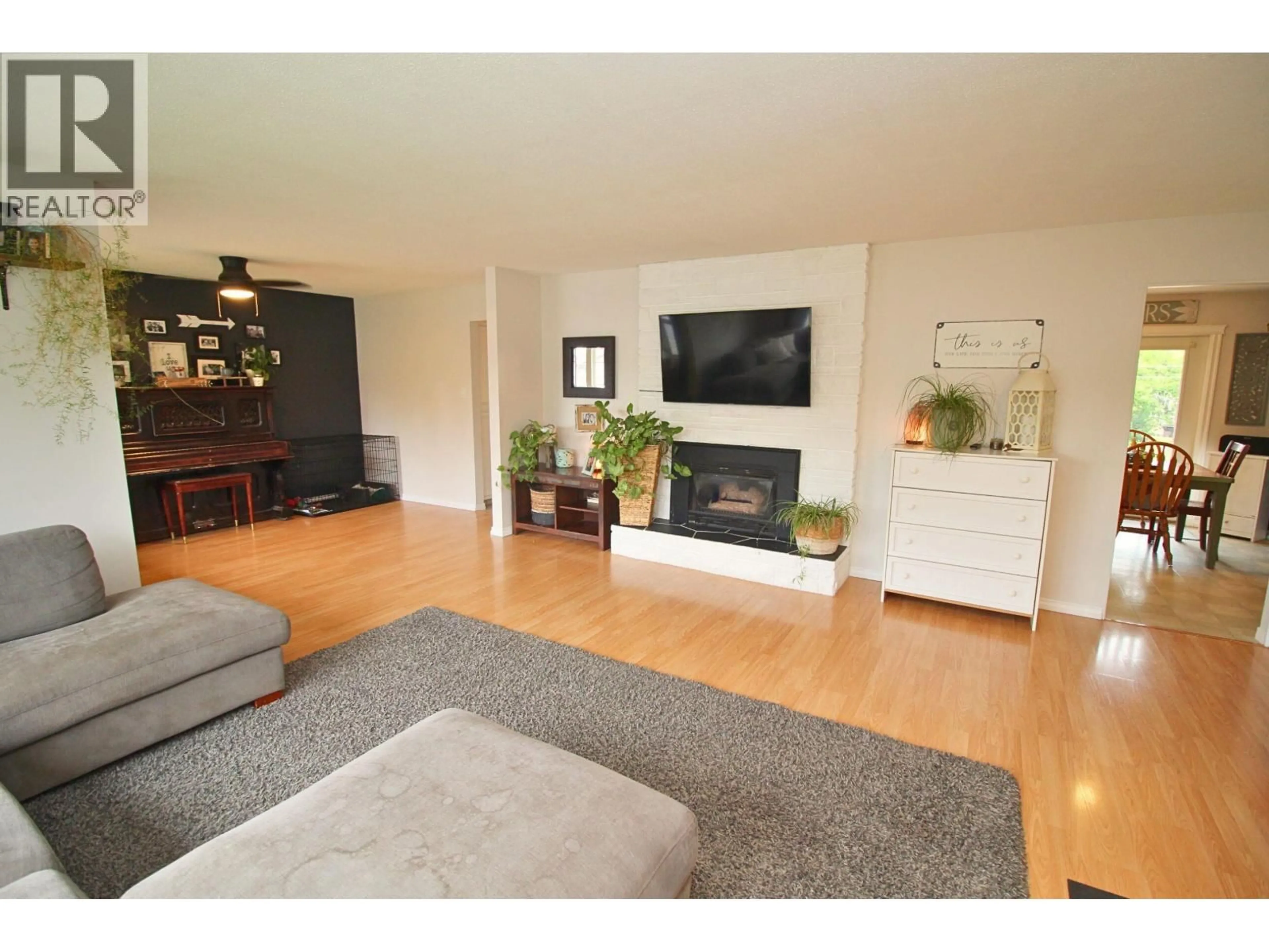 Living room with furniture, wood/laminate floor for 3369 GILLESPIE ROAD, Houston British Columbia V0J1Z0