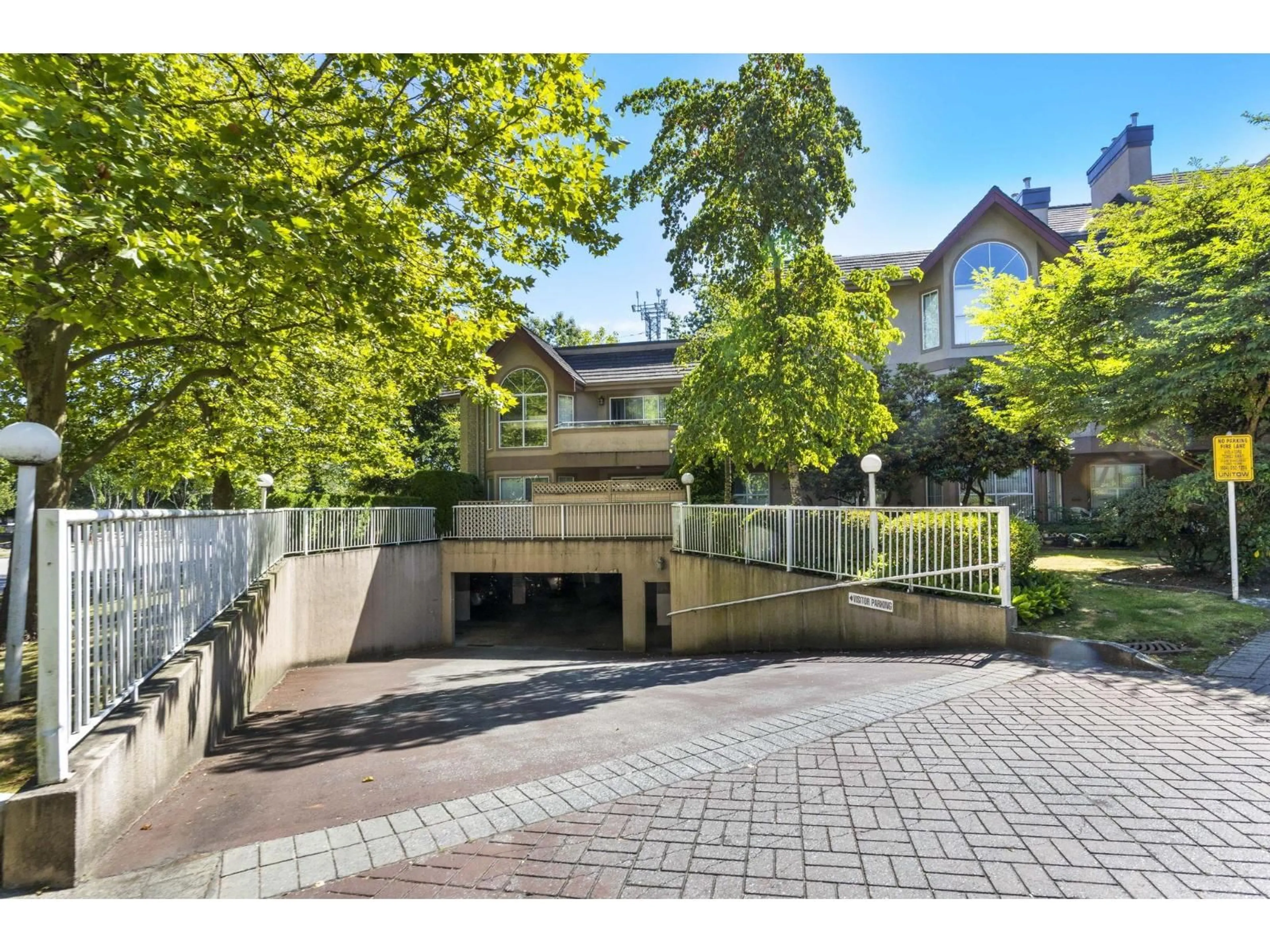 A pic from outside/outdoor area/front of a property/back of a property/a pic from drone, street for 310 - 7435 121A, Surrey British Columbia V3W0W8