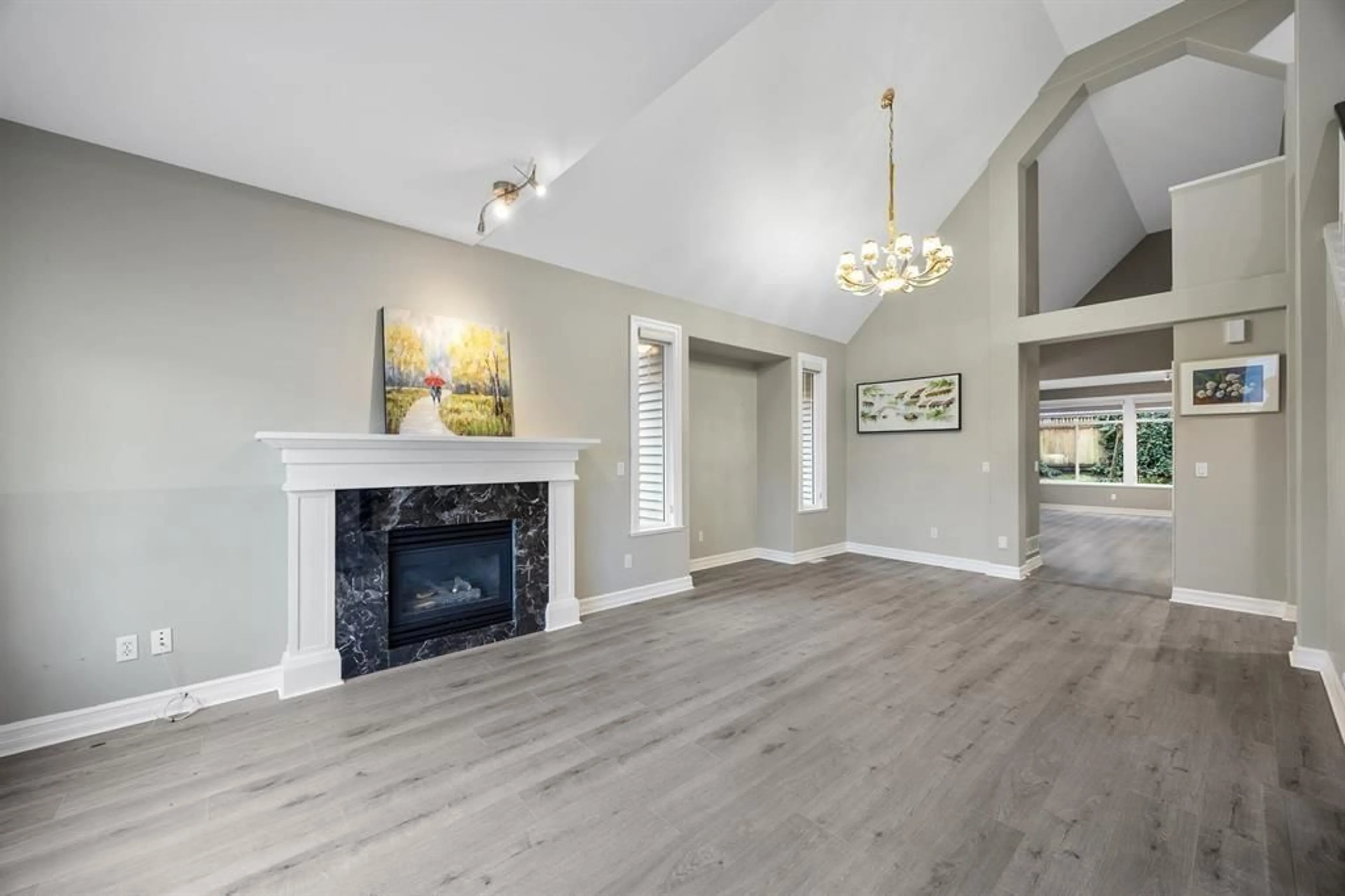 Living room with furniture, wood/laminate floor for 15460 36A, Surrey British Columbia V3Z0G9