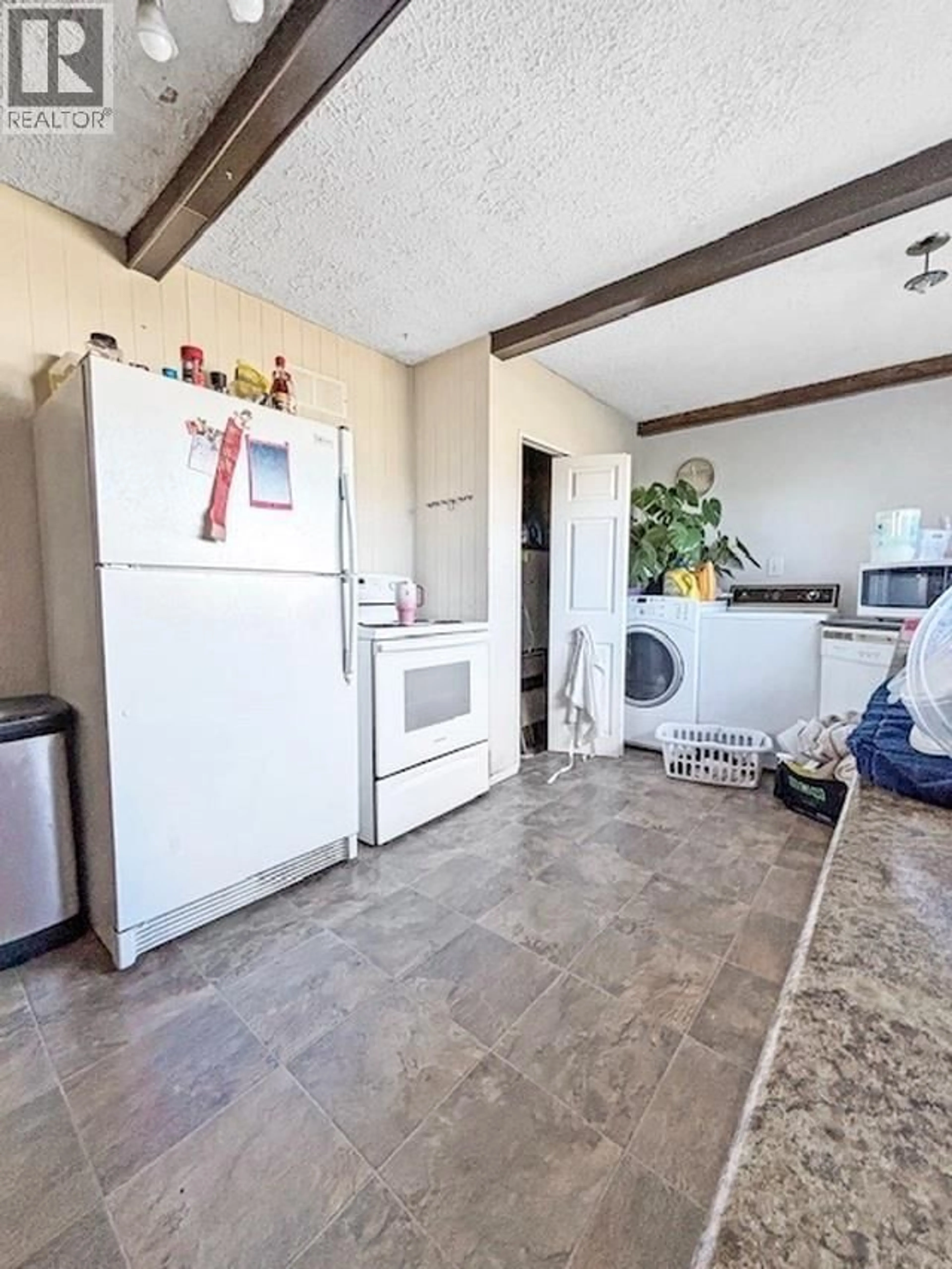 Kitchen with laundary machines, unknown for 21 KECHIKA STREET, Kitimat British Columbia V8C1Y7