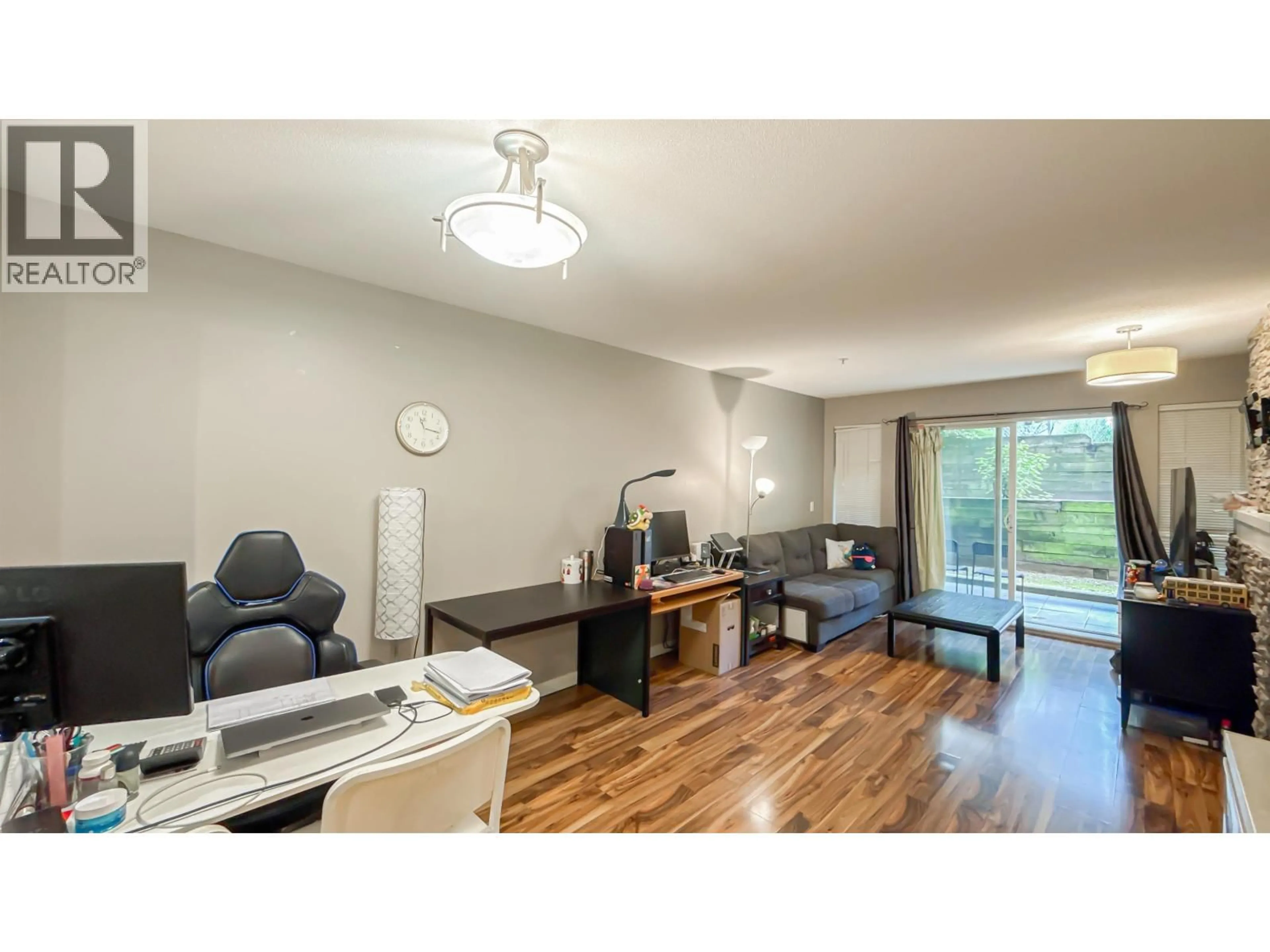 Living room with furniture, wood/laminate floor for 206 - 9098 HALSTON COURT, Burnaby British Columbia V3N0A6