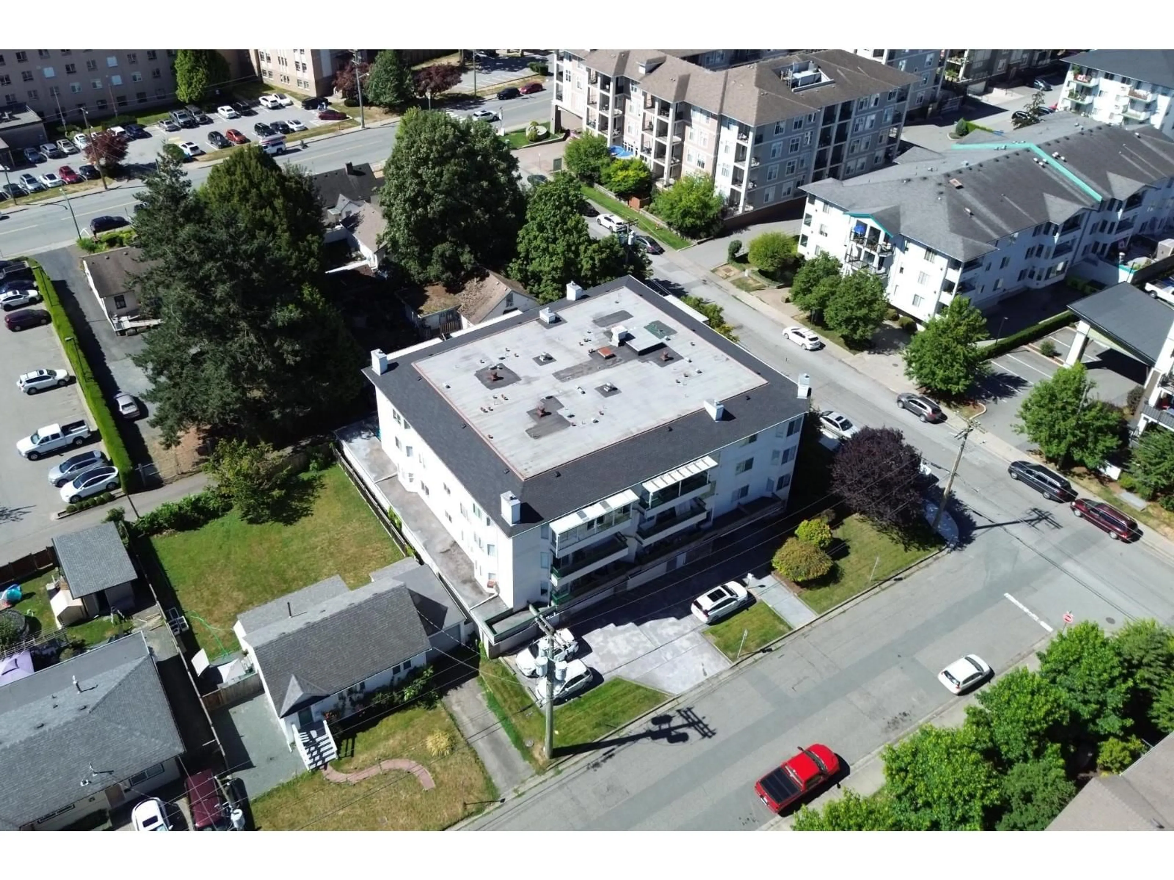 A pic from outside/outdoor area/front of a property/back of a property/a pic from drone, building for 102 - 45604 BRETT AVENUE, Chilliwack British Columbia V2P1N9