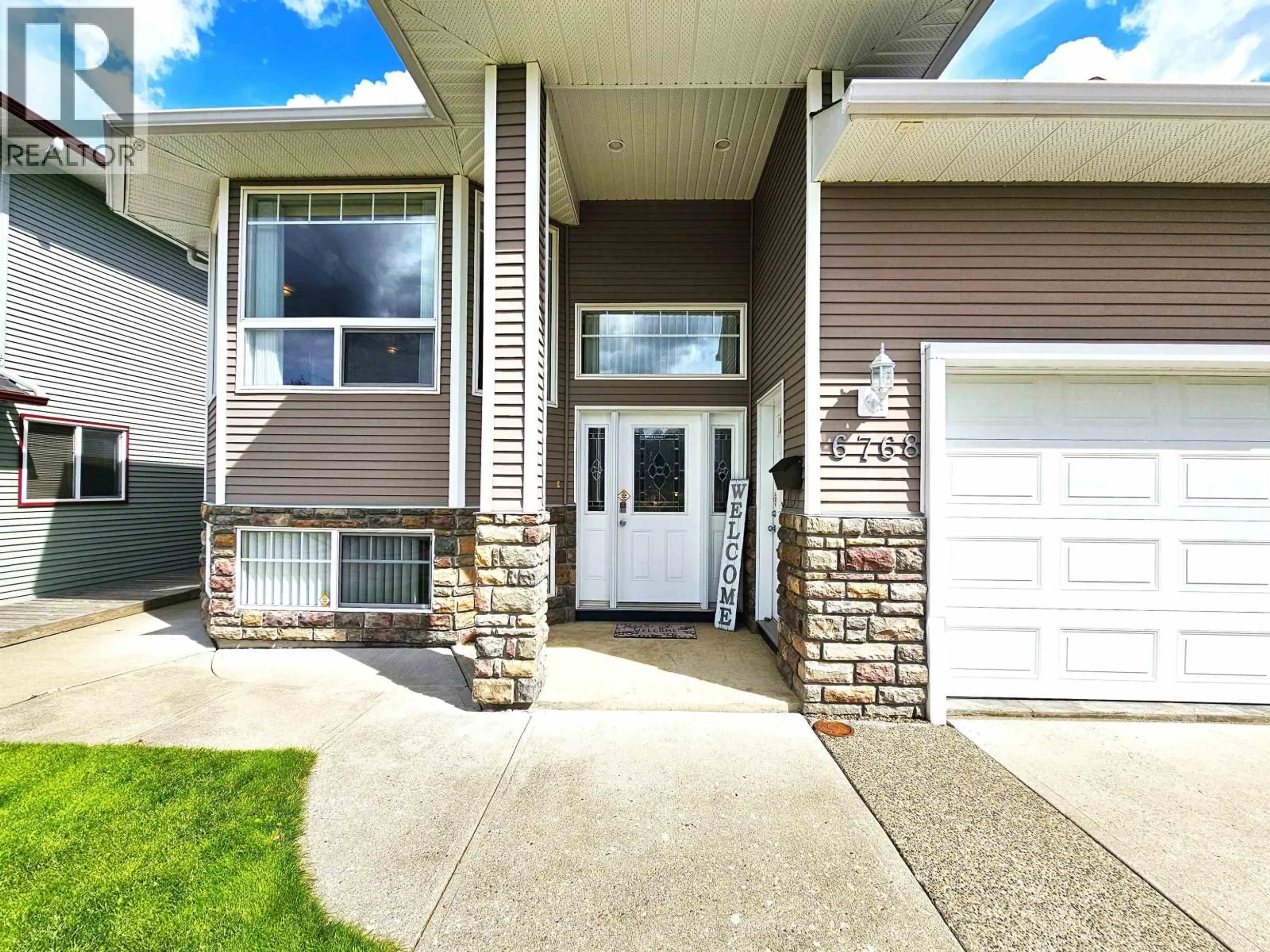 Home with vinyl exterior material, street for 6768 CHARTWELL CRESCENT, Prince George British Columbia V2N6Y3