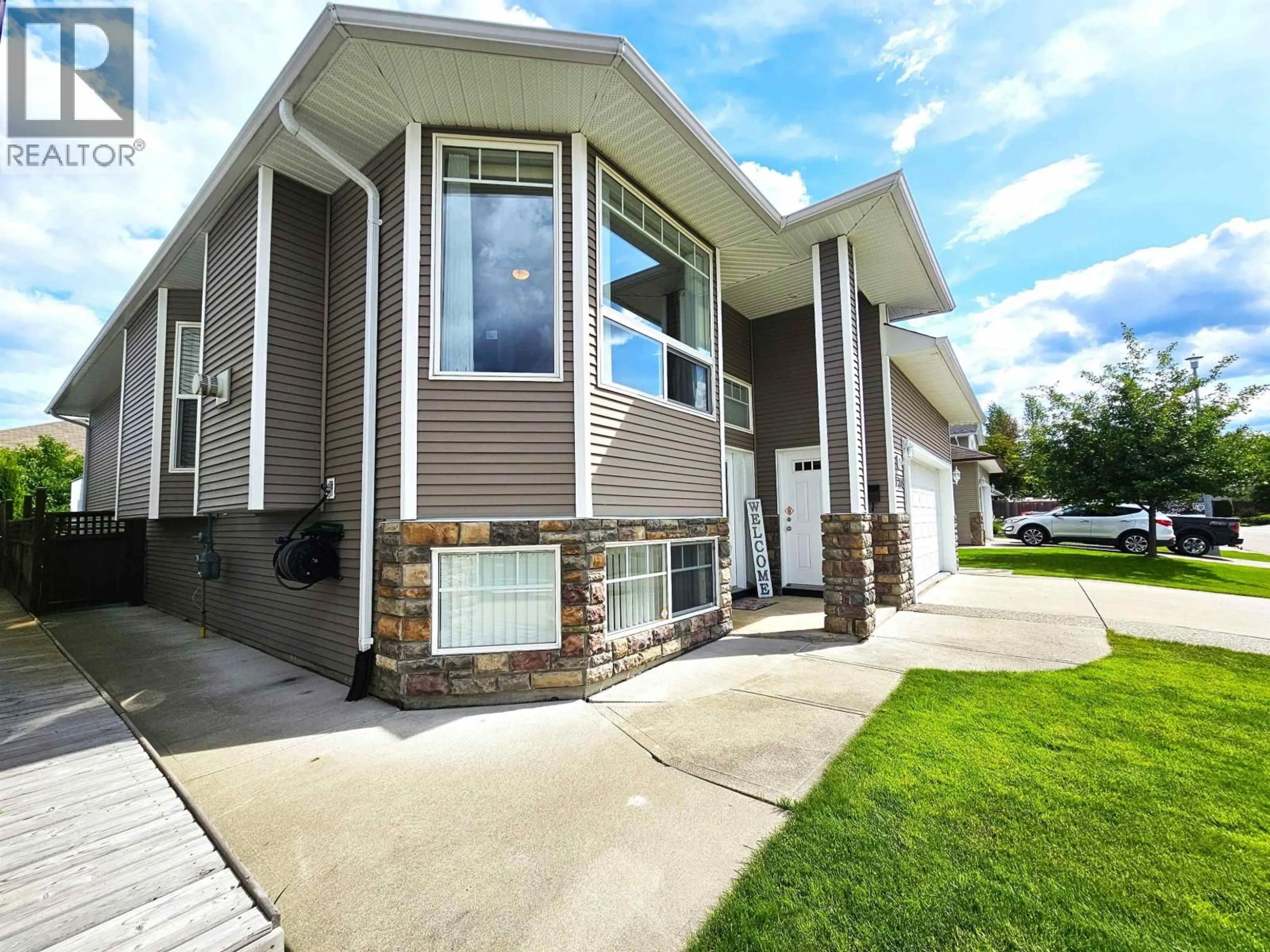 Home with vinyl exterior material, street for 6768 CHARTWELL CRESCENT, Prince George British Columbia V2N6Y3