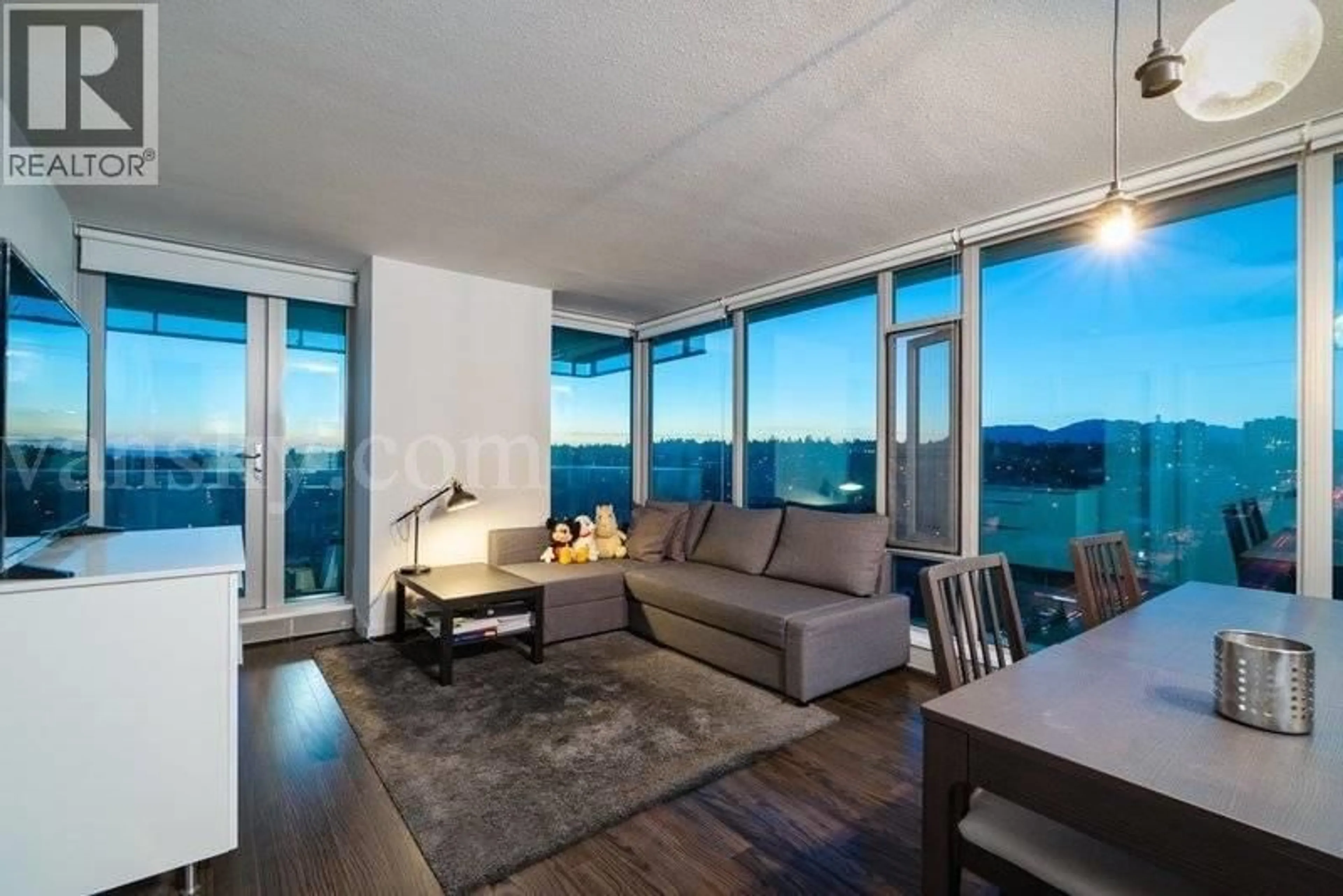 Living room with furniture, wood/laminate floor for 1702 - 8031 NUNAVUT LANE, Vancouver British Columbia V5X0C9