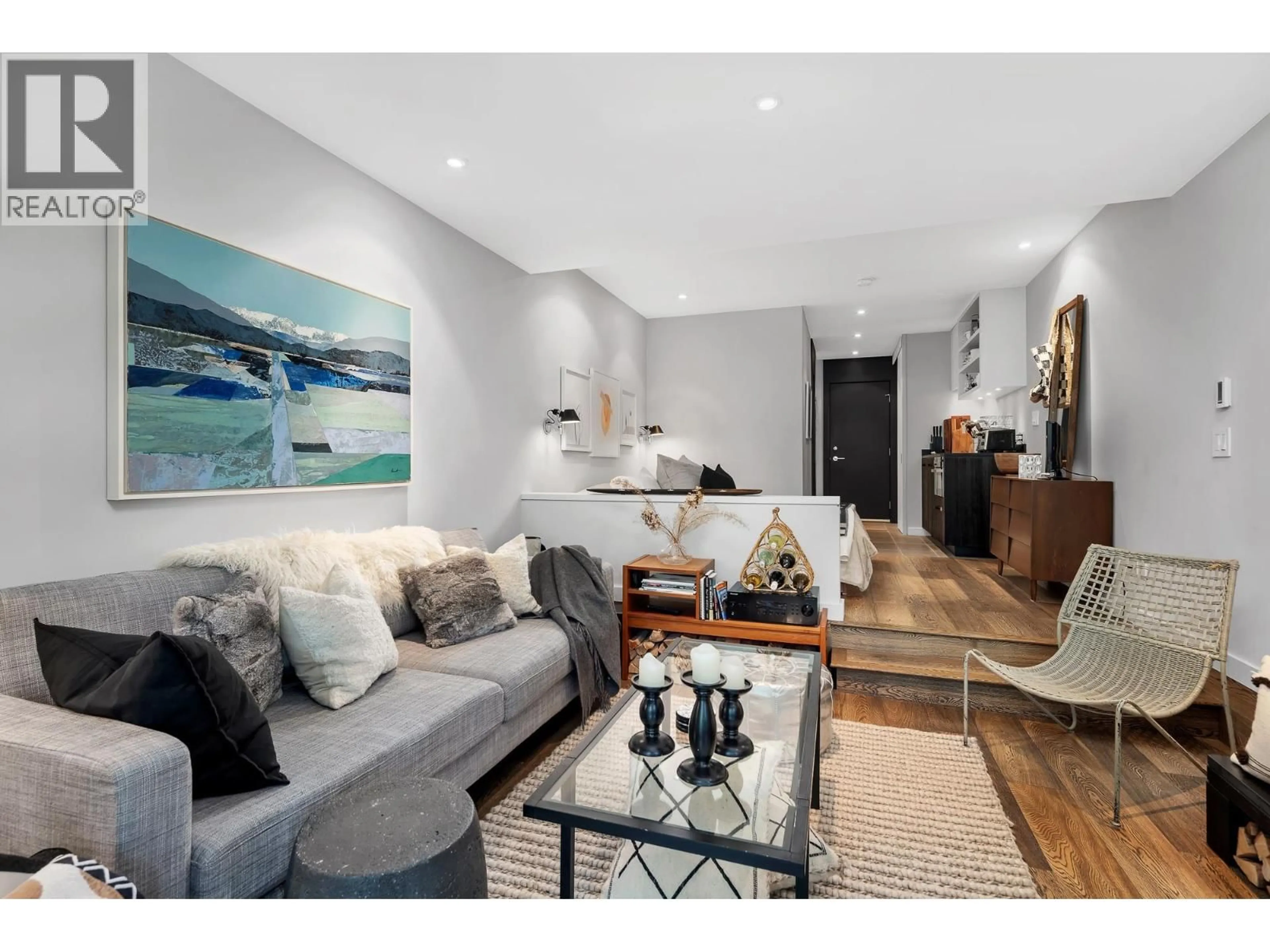 Living room with furniture, wood/laminate floor for 103 - 6850 CRABAPPLE DRIVE, Whistler British Columbia V8E0C5