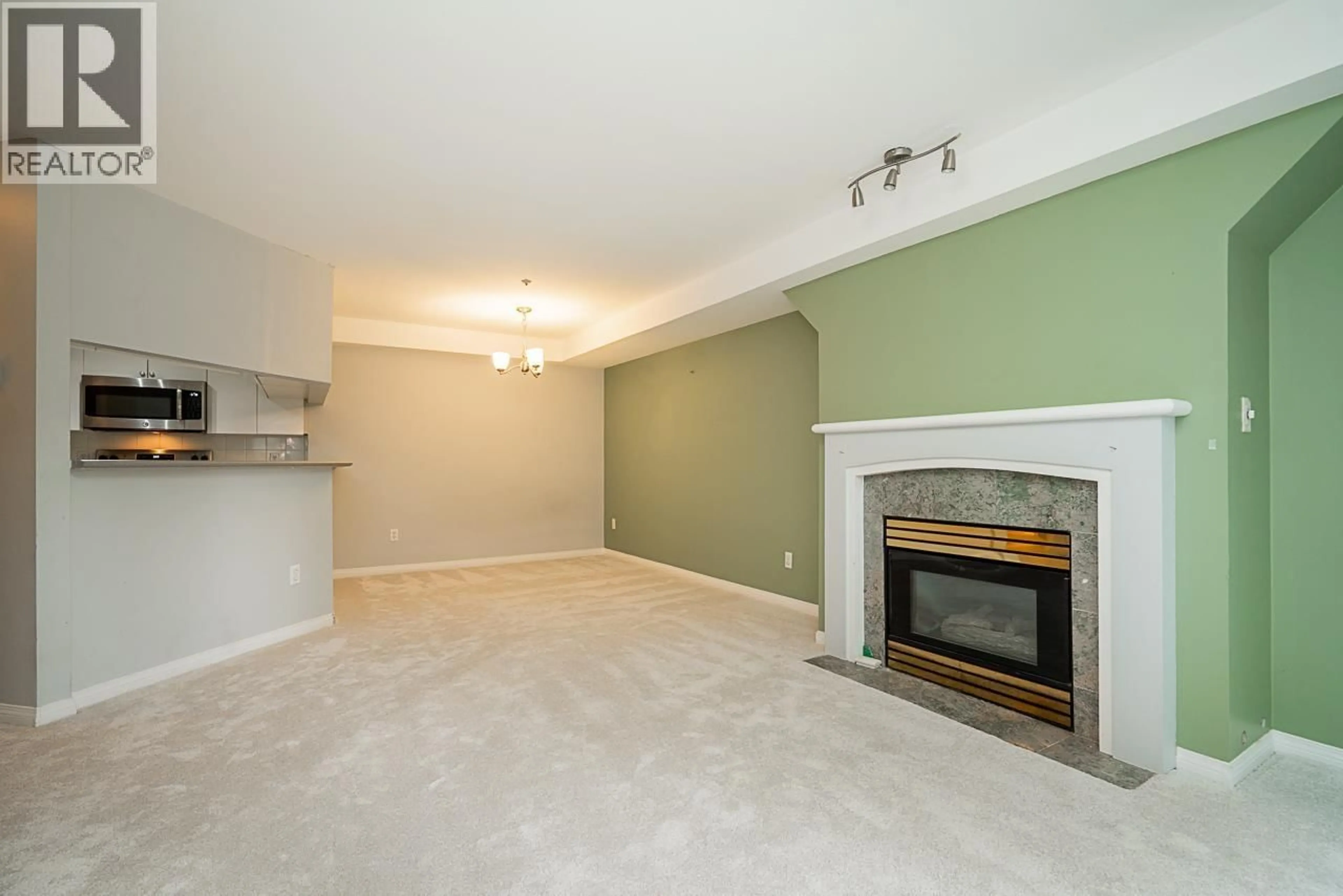 Living room with furniture, unknown for 107 - 8430 JELLICOE STREET, Vancouver British Columbia V5S4S8